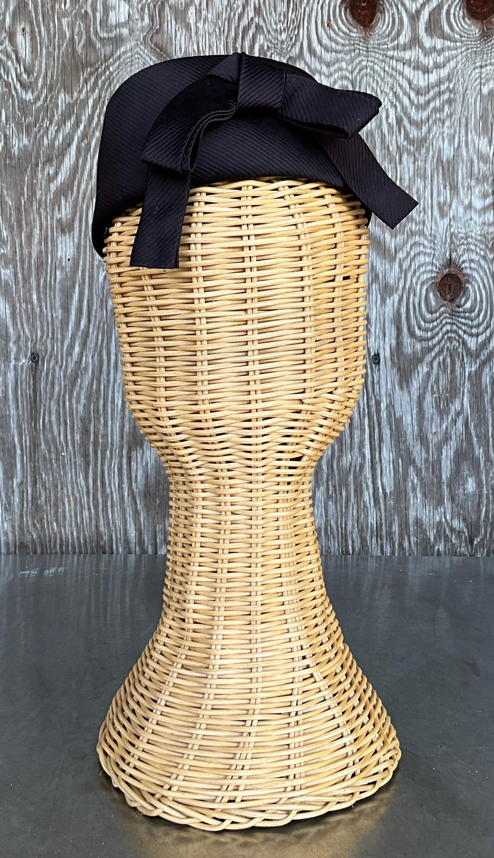 A Vintage French Room Pillbox Hat refers to a specific style of hat that was popular in the mid-20th century, particularly in the 1950s and 1960s. It is characterized by its round, flat top and a narrow, often vertical or slightly slanted profile.