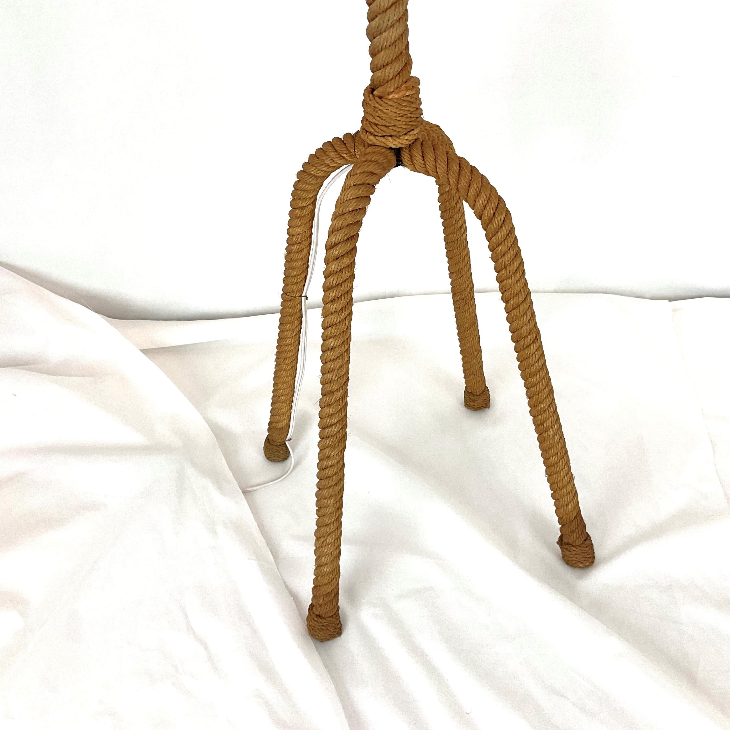 Bring a touch of coastal charm into your home with this unique rope floor lamp. Featuring a tall, twisted rope design with a knotted base, this piece adds rustic elegance and a nautical vibe to any space. Its natural rope texture blends beautifully