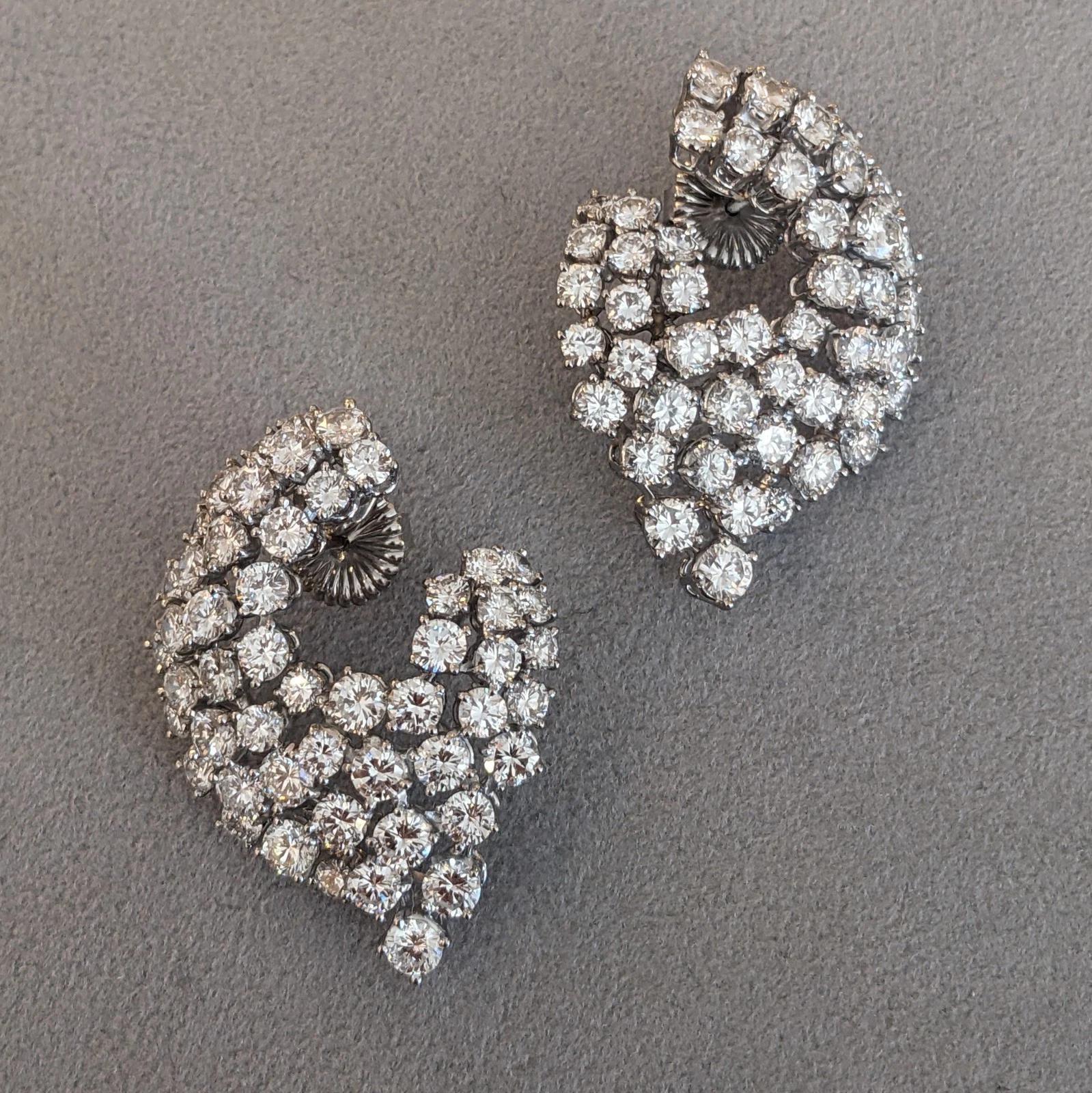 French Round Diamond Swirl Earrings 15.00 cttw in Platinum 

French made Diamond Earrings feature Natural Round Brilliant Diamonds clustered in a swirl design set in Platinum with Platinum posts and 18k White Gold backs.

Total diamond weight is