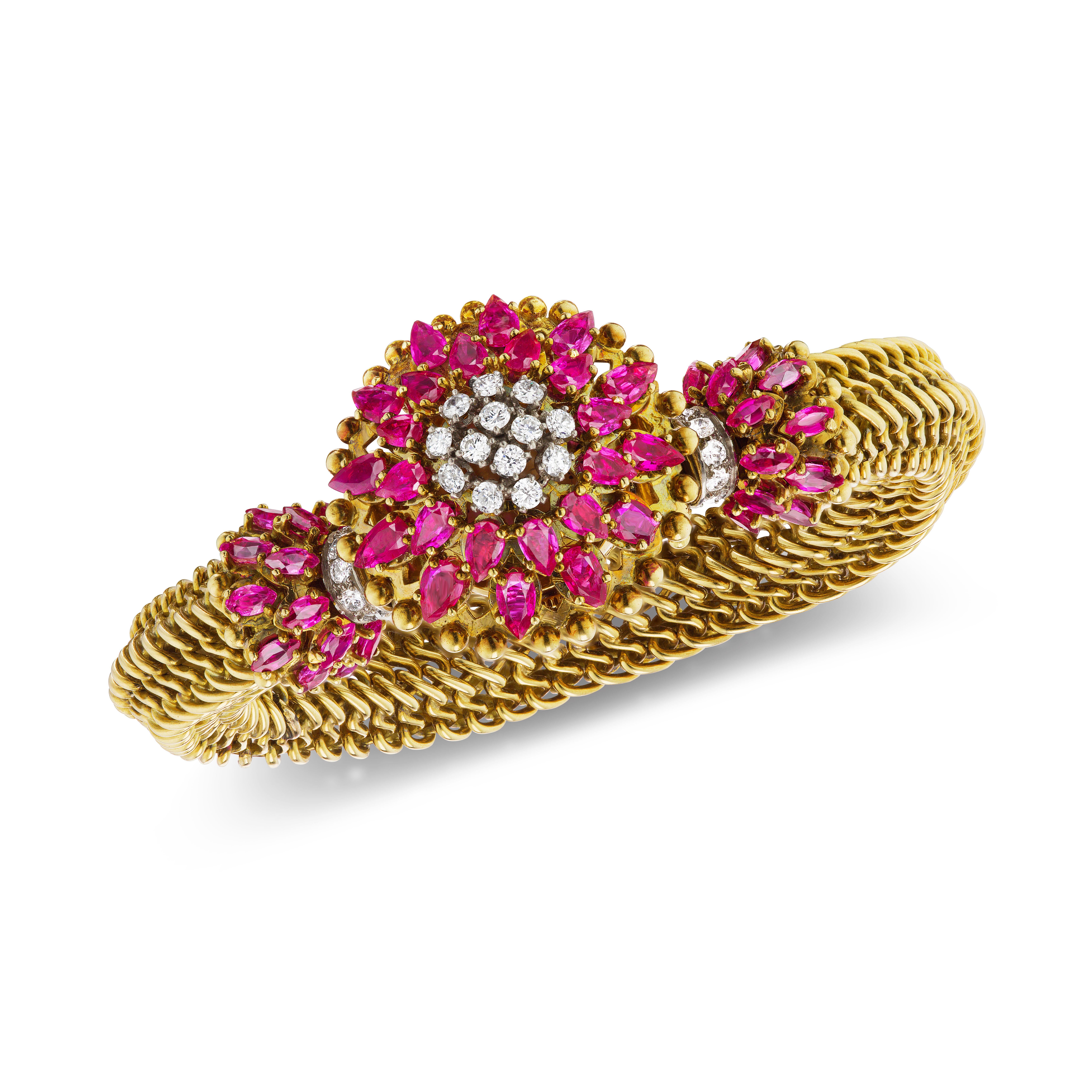 This fabulous 18 Karat gold chain mail vintage bracelet features a covered watch adorned with 24 pear-shape rubies of exceptional quality and 9 round brilliant diamonds. There are 26 additional oval rubies and 10 round brilliant diamonds mounted at