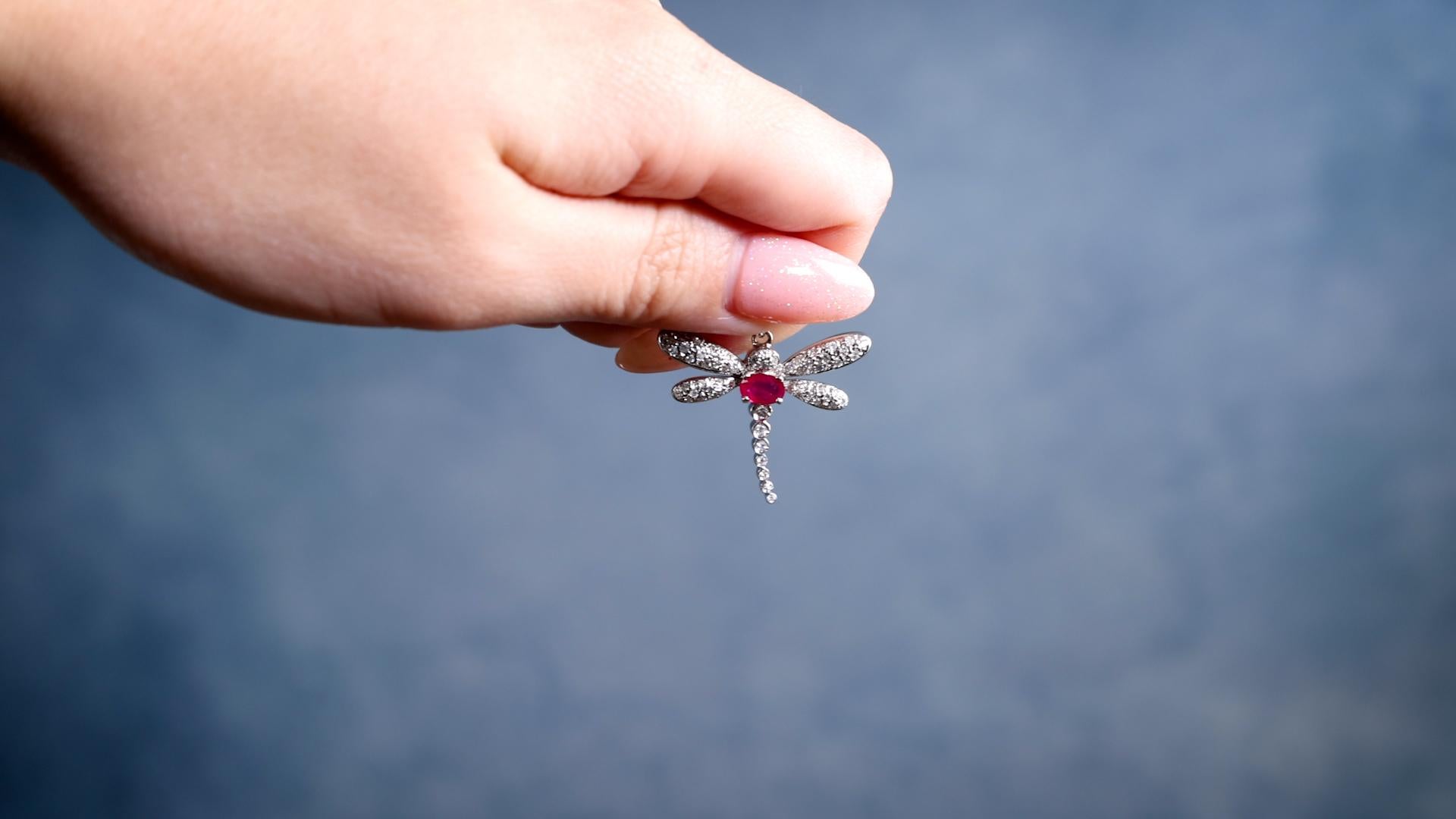 One Vintage French Ruby Diamond 18k White Gold Dragonfly Pendant. Featuring one oval cut ruby weighing approximately 0.40 carat. Accented by 57 round brilliant cut diamonds with a total weight of approximately 0.35 carat, graded H-I color, SI-I