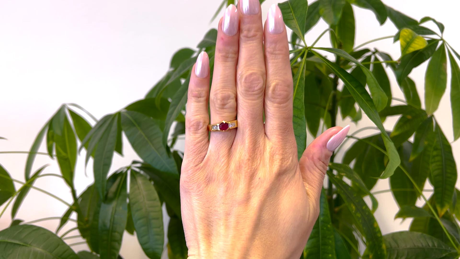 One Vintage French Ruby Diamond 18k Yellow Gold Ring. Featuring one oval mixed cut ruby weighing approximately 0.75 carat. Accented by four princess cut diamonds with a total weight of approximately 0.40 carat, graded F-G color, VS clarity. Crafted