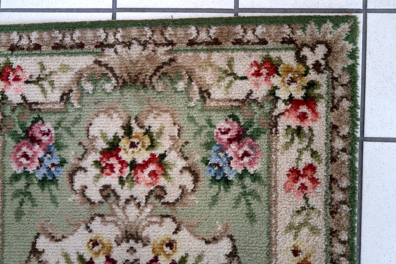 Vintage French Savonnerie rug in green and beige colors. The rug has been made in the end of 20th century. It is in original good condition. The rug is machine made.

-condition: original good,

-circa: 1960s,

-size: 2.2' x 4.2' (69cm x