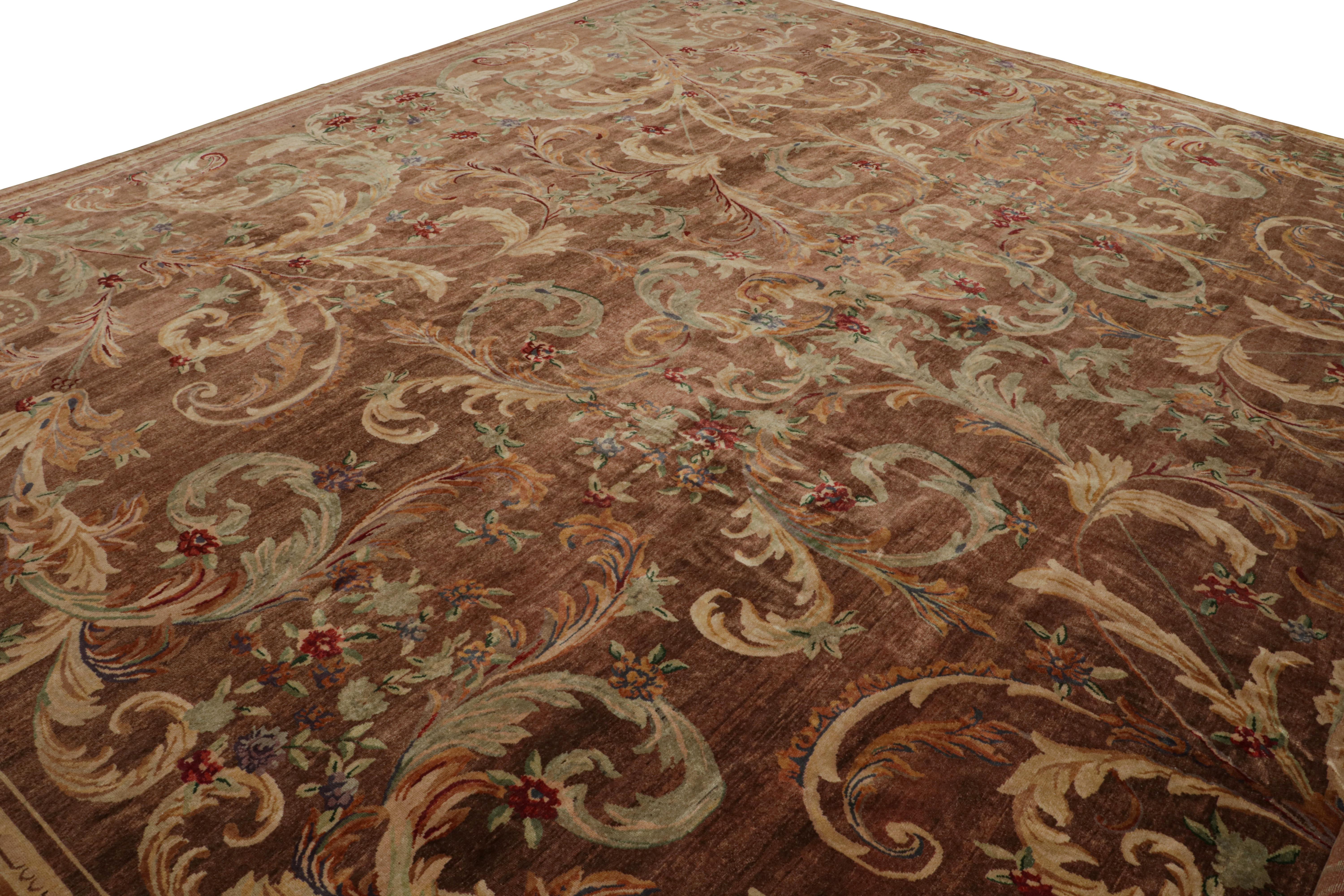 Hand-knotted in wool, this rare 18x19 vintage oversized French Savonnerie rug features a rich brown field and colorful floral pattern in a most unusual style that’s drawn from the border inward. 

On the Design: 

One of the richest examples of the