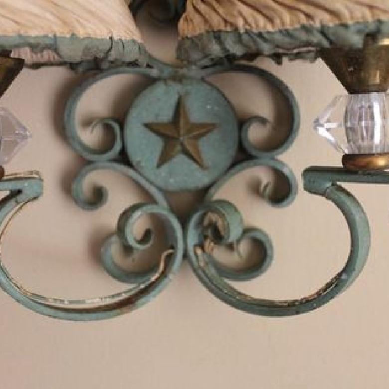 Tres charming vintage metal sconce featuring star embellishment, crystal detail, brass trim and fabric lamp shades. 

Approximately 12