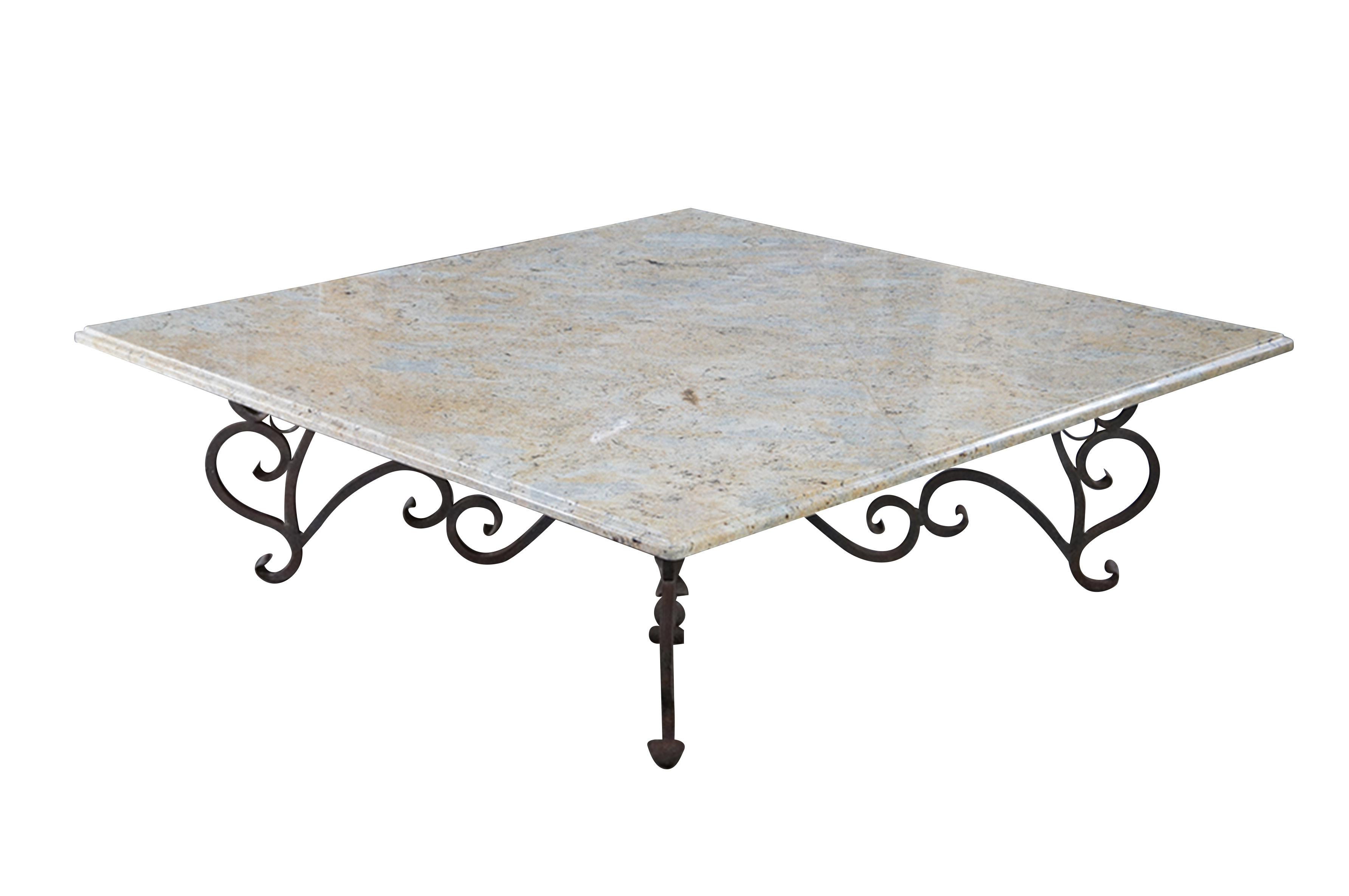 A large and impressive coffee table featuring square form with French scrolled / serpentine wrought iron base and heavy Granite stone top with beveled edge.  Very heavy.

Dimensions:
60