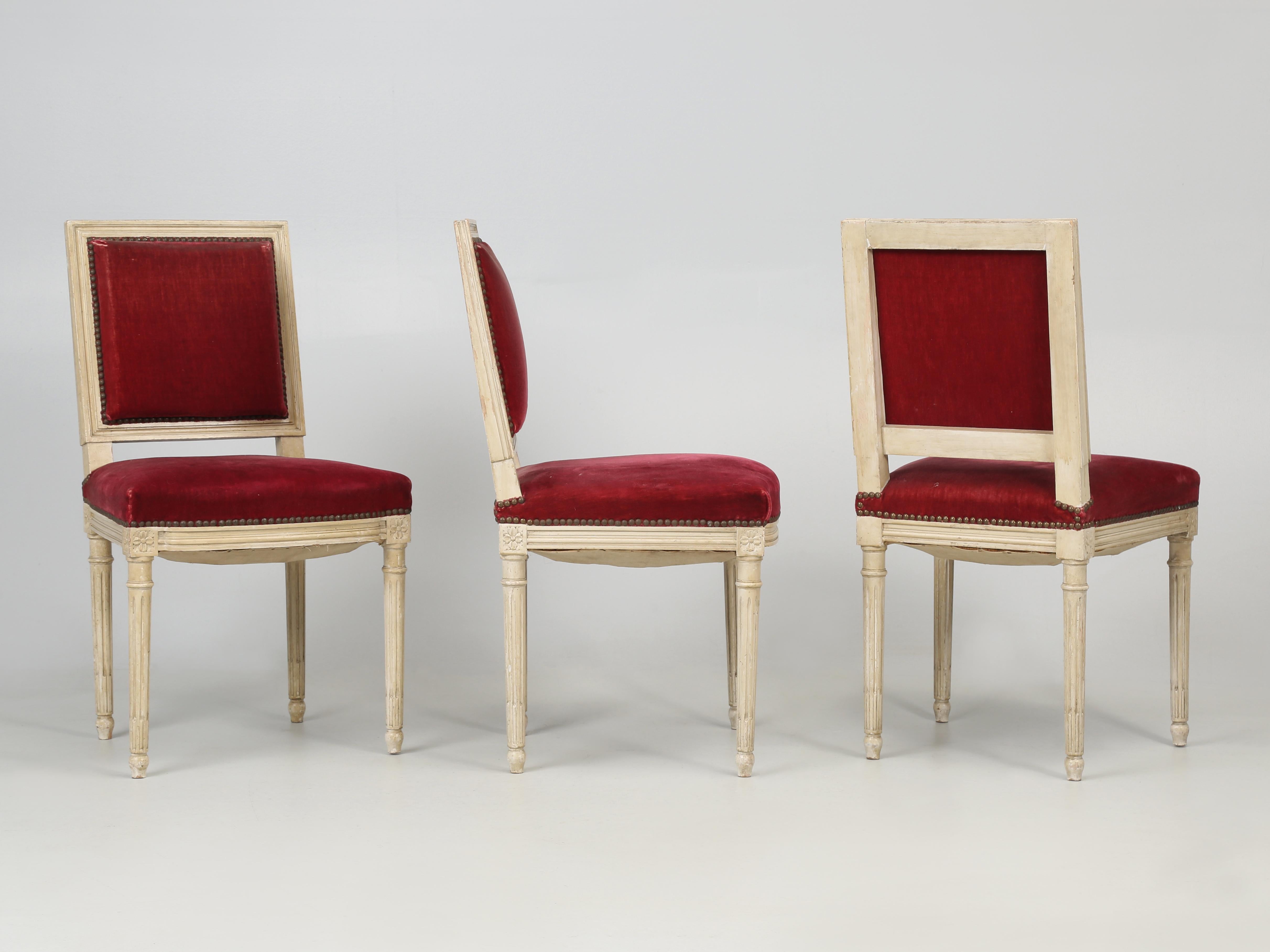 French Louis XVI style dining chairs, set of (6) surprisingly still in their original mohair fabric, although it definitely has seen better days. The paint as well on these Louis XVI dining chairs is also original, but appears to have some sort of