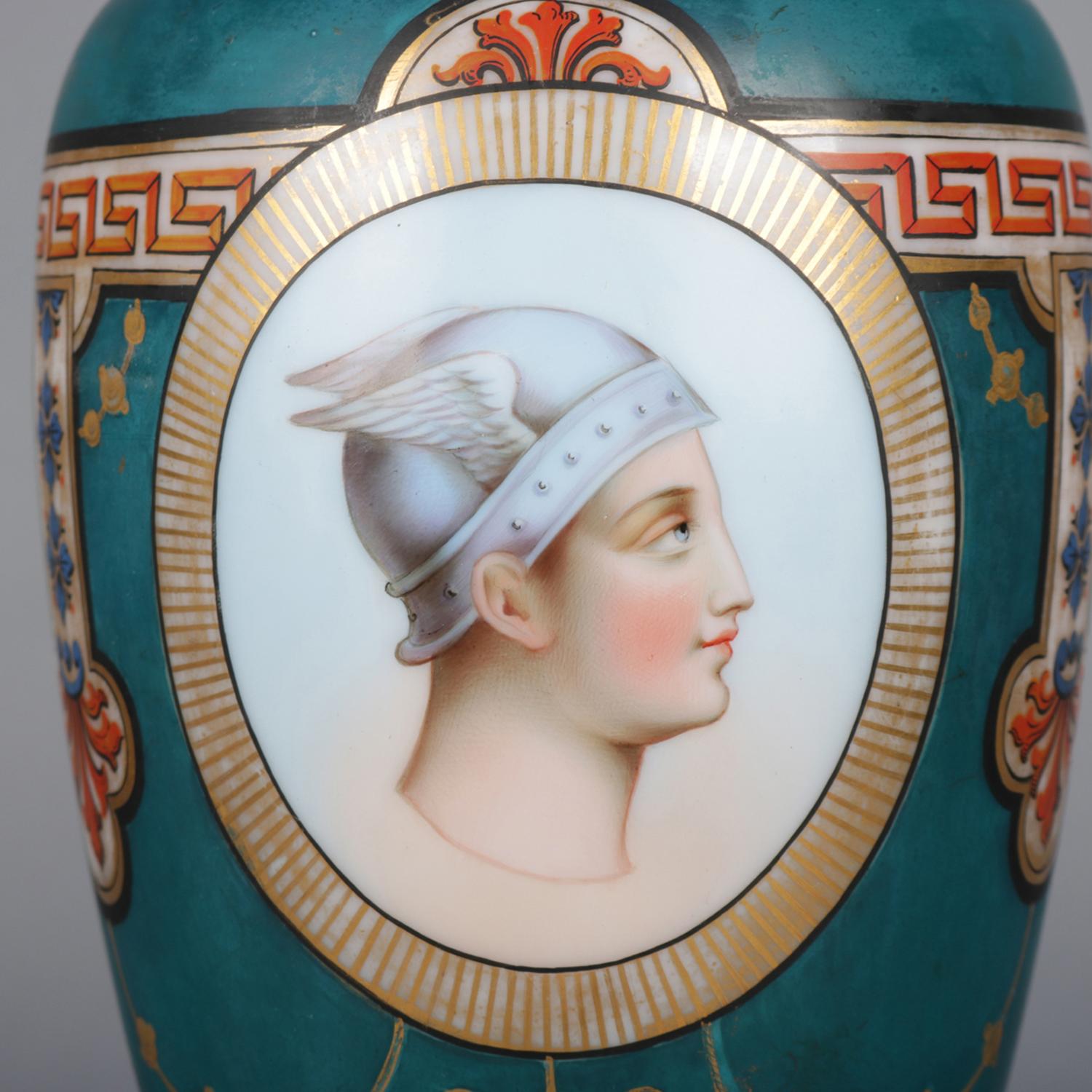 Vintage French Sevres school porcelain portrait lamp features urn form with hand painted and gilt reserve of Perseus (Greek mythology) in his winged helmet, Greek key collar and gilt highlights throughout; seated on pierced scroll form cast brass