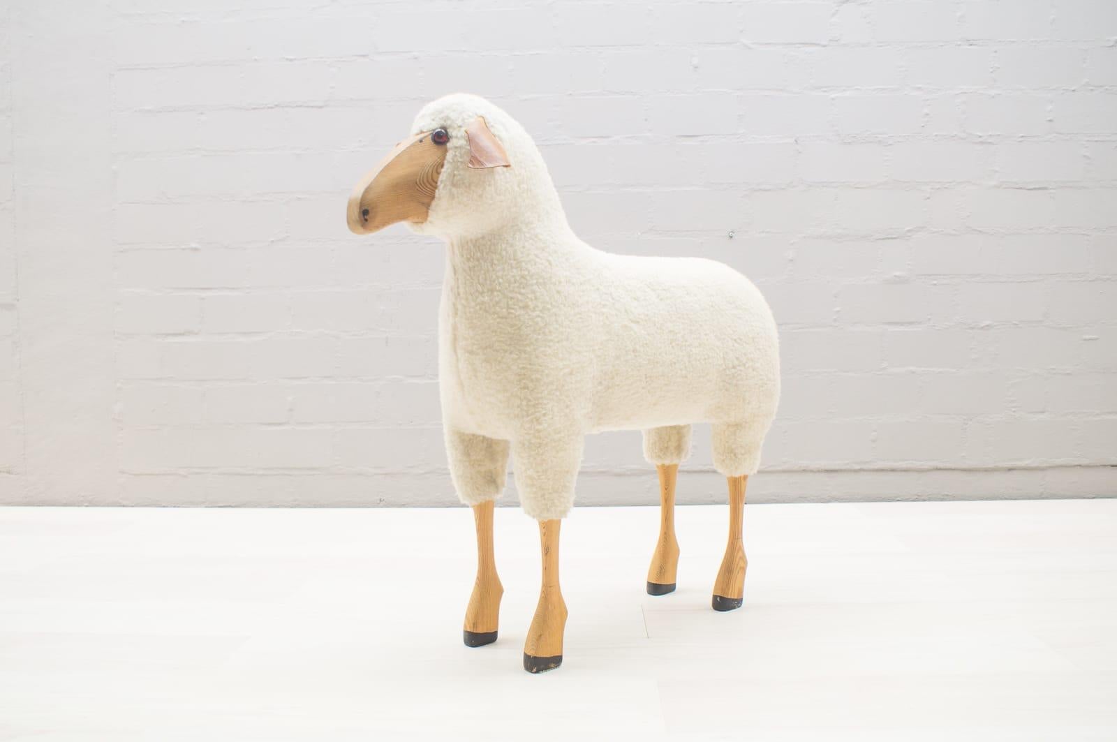 This vintage sheep stool features a matching footstool.
 
