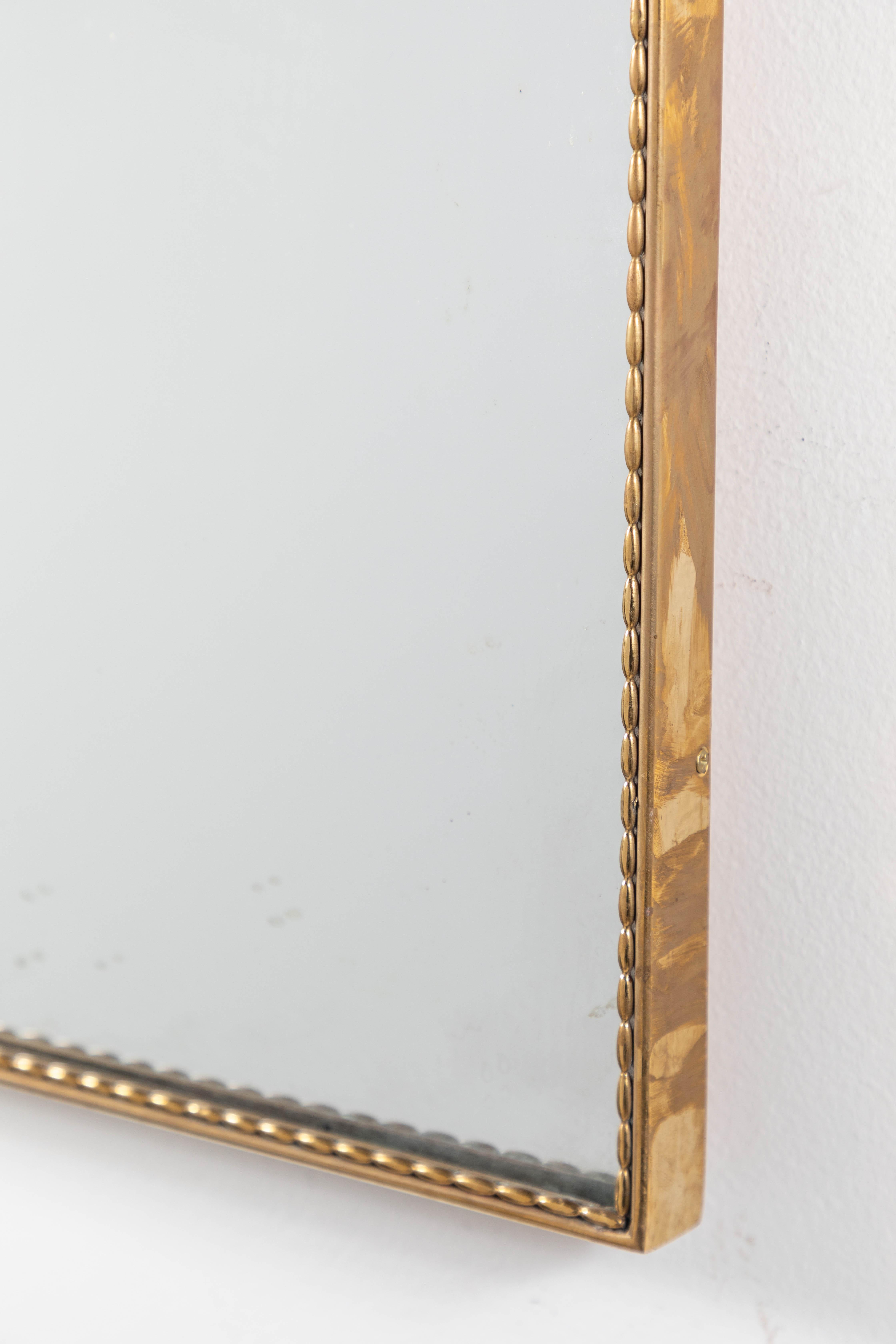 Mid-20th Century Vintage French Shield Mirror with Intricate Brass Beading
