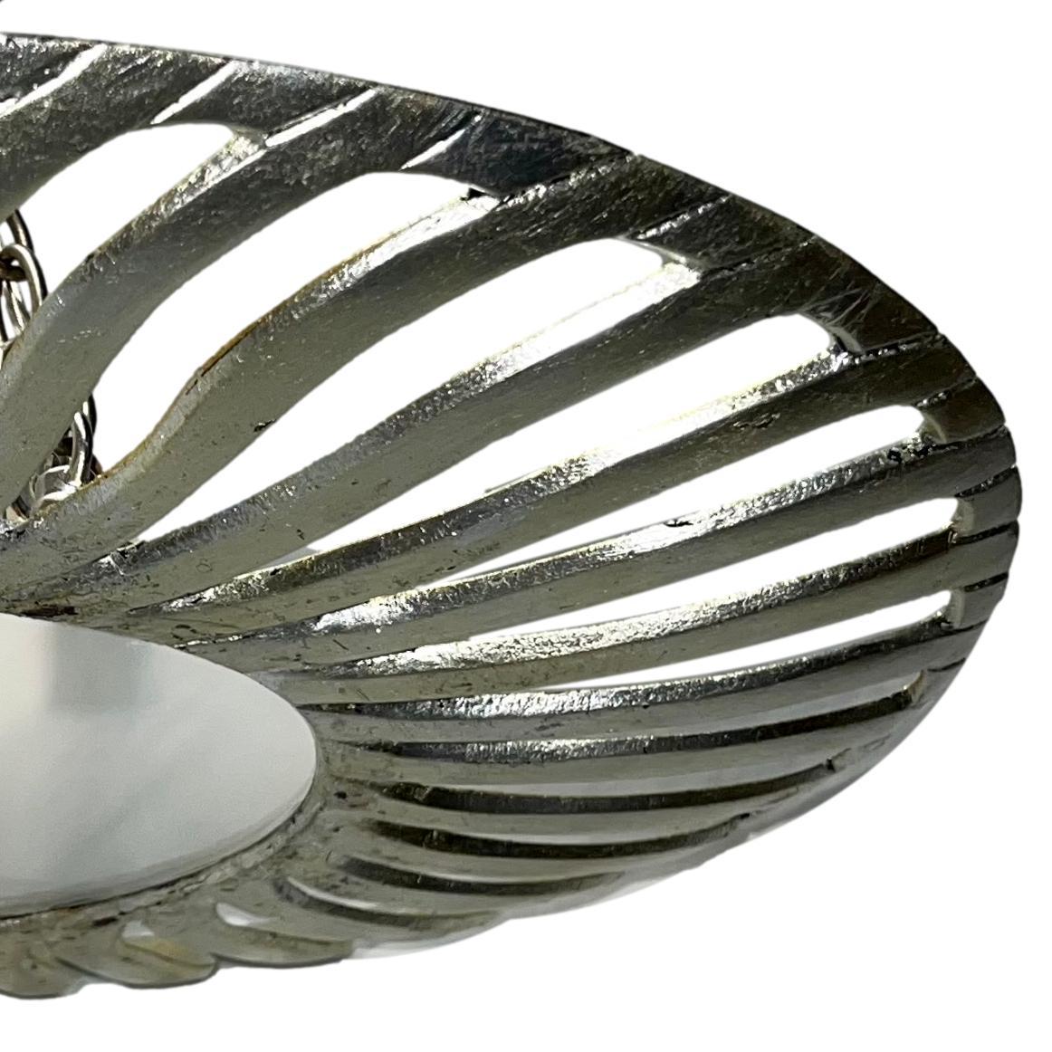 A circa 1960's Italian silver leaf light fixture with glass inset and three candelabra lights.

Measurements:
Drop: 11