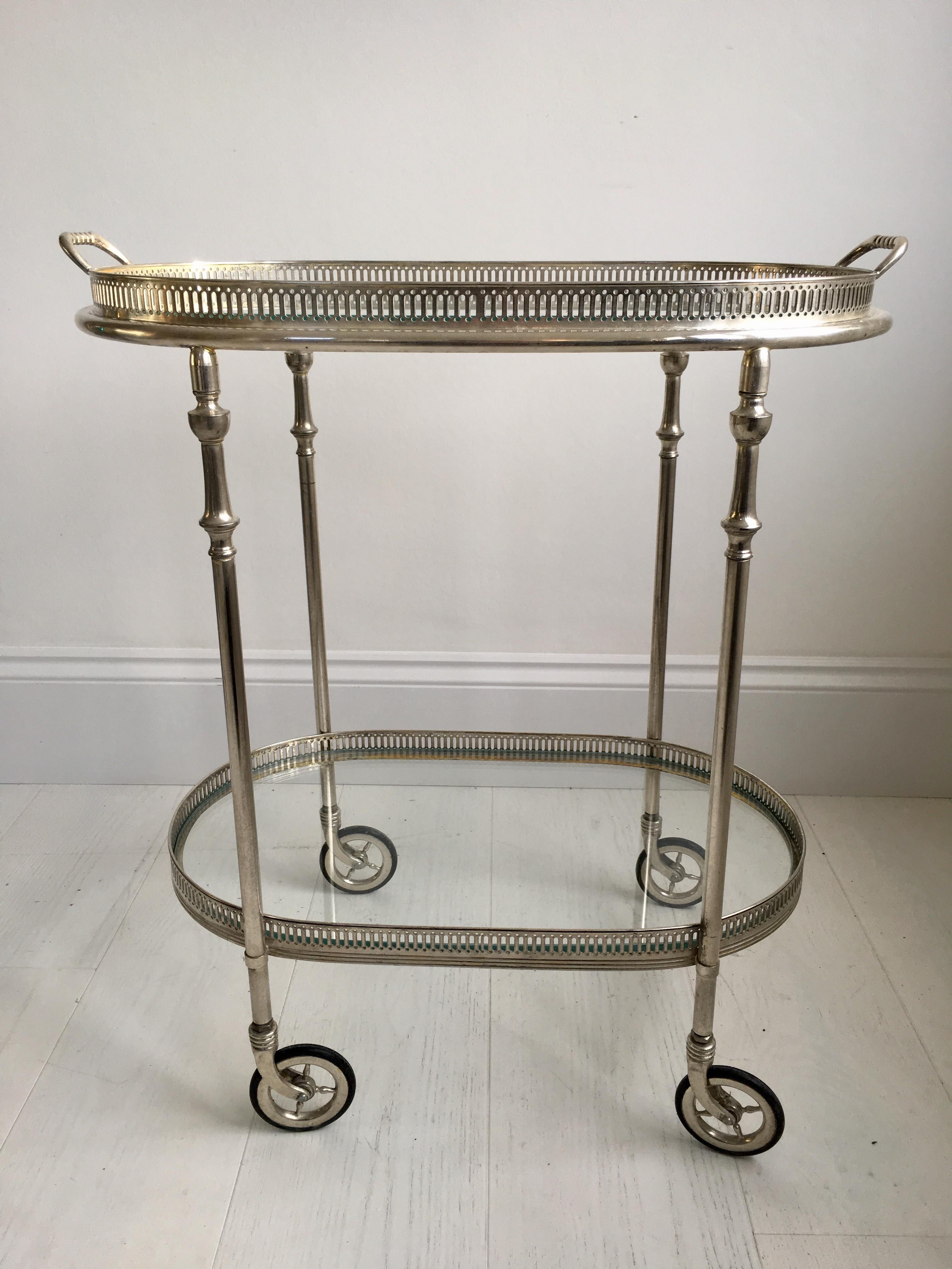 Vintage drinks trolley from France, circa 1950.

Polished silver frame with lift off top tray.

Perfect for smaller spaces.

Overall dims 55cm wide (incl handles), 34cm deep and 63cm tall (60cm to glass).