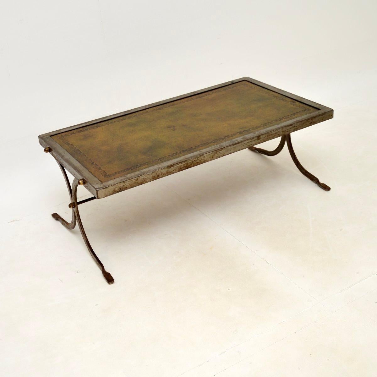 A smart and unusual vintage French steel and leather coffee table, dating from the 1960’s.

This has a great design, the quality is amazing and it is a useful size. The steel frame has acquired a gorgeous patina, there are brass rivets and a tooled