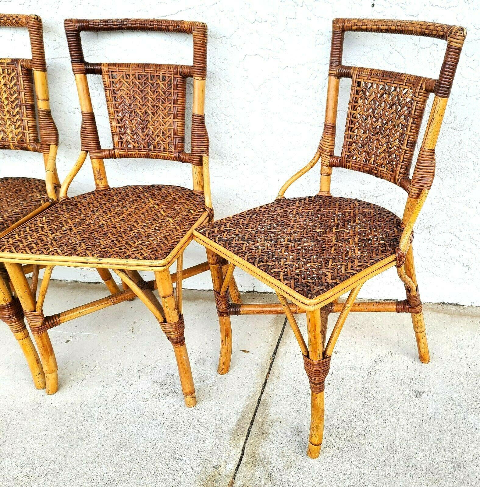 Offering One Of Our Recent Palm Beach Estate Fine Furniture Acquisitions Of A Set of 4 Vintage French Style Bamboo Rattan Wicker Dining Chairs 
Very well made chairs with supporting cross straps under the seats.

Approximate Measurements in