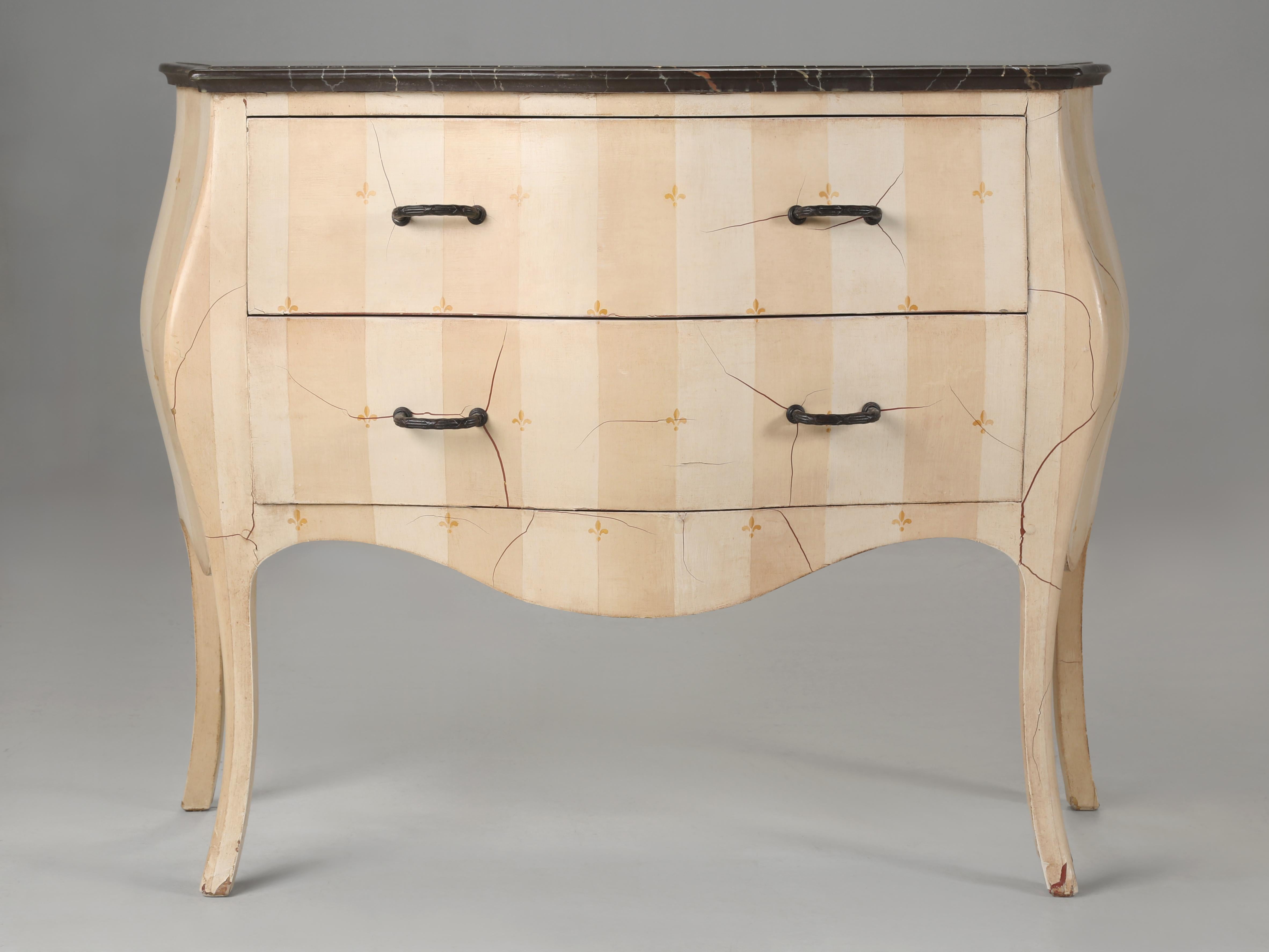 Vintage French Bombé style Commode that was repainted a long time ago with an incredible faux marble top. We have seen numerous faux painted marble tops in our 35-year history, but none compared to this artist's interpretation of how real marble is