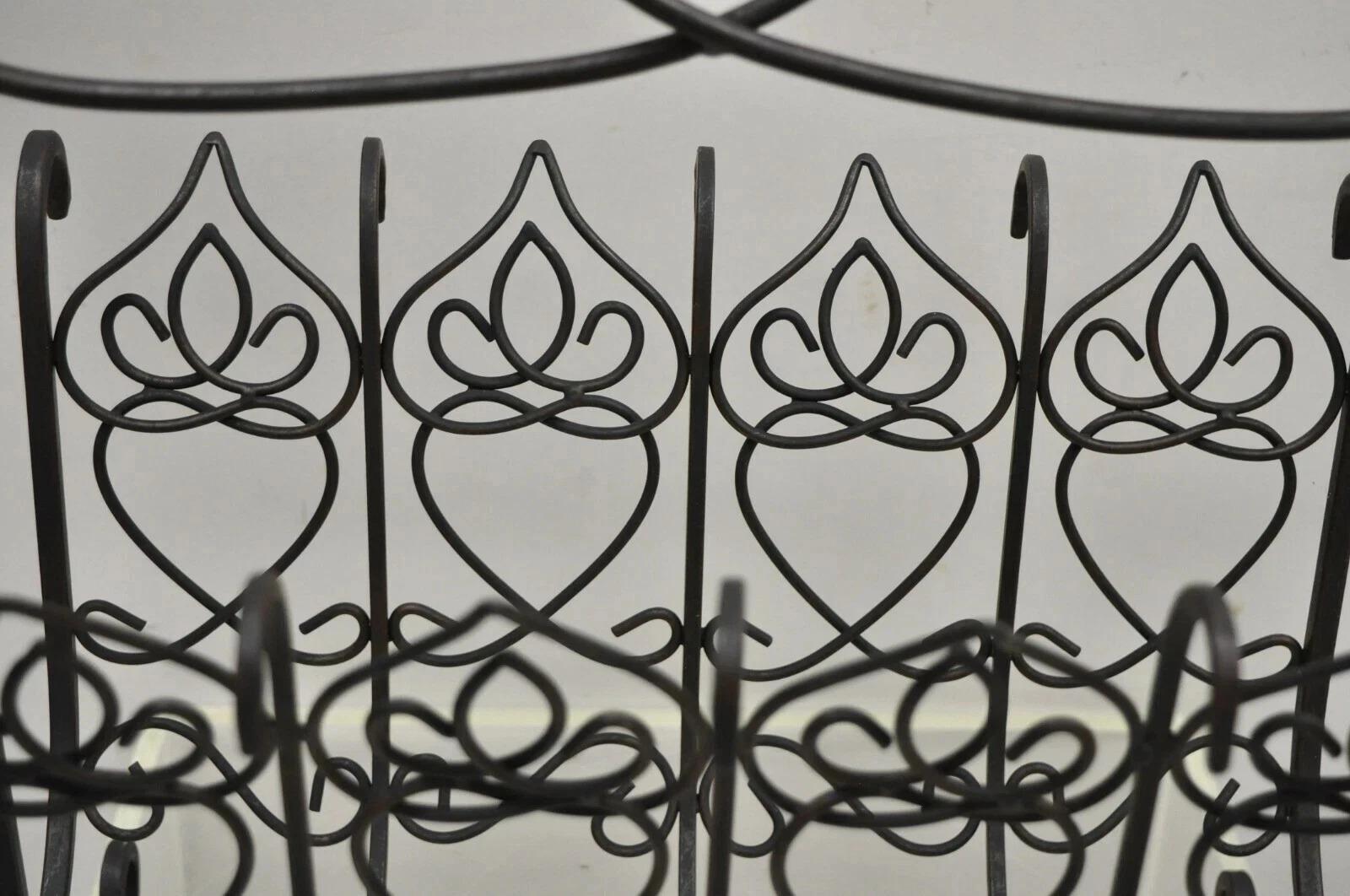 Vintage French Style Scrolling Wrought Iron Magazine Rack Stand with Heart. Item features scrolling wrought iron frame, heart design, great style and form. Circa Mid 20th Century. Measurements: 16.75