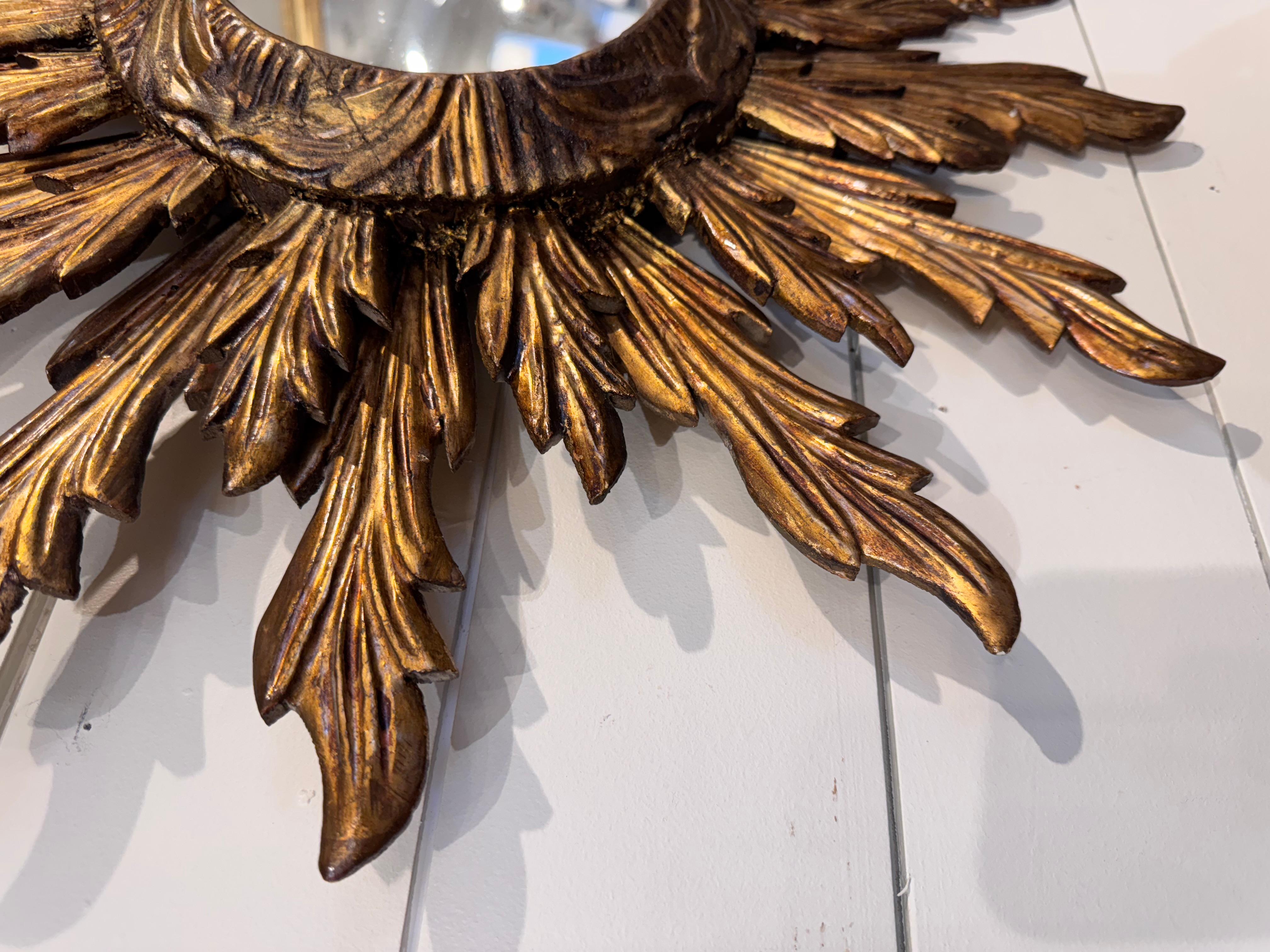 Sunburst mirrors are regal things, and this one reflects the splendor of The Sun itself! Hailing from the 1940s, this one features a double set of rays and a convex mirror.
We're sure you'll find a place to brings its glory into your