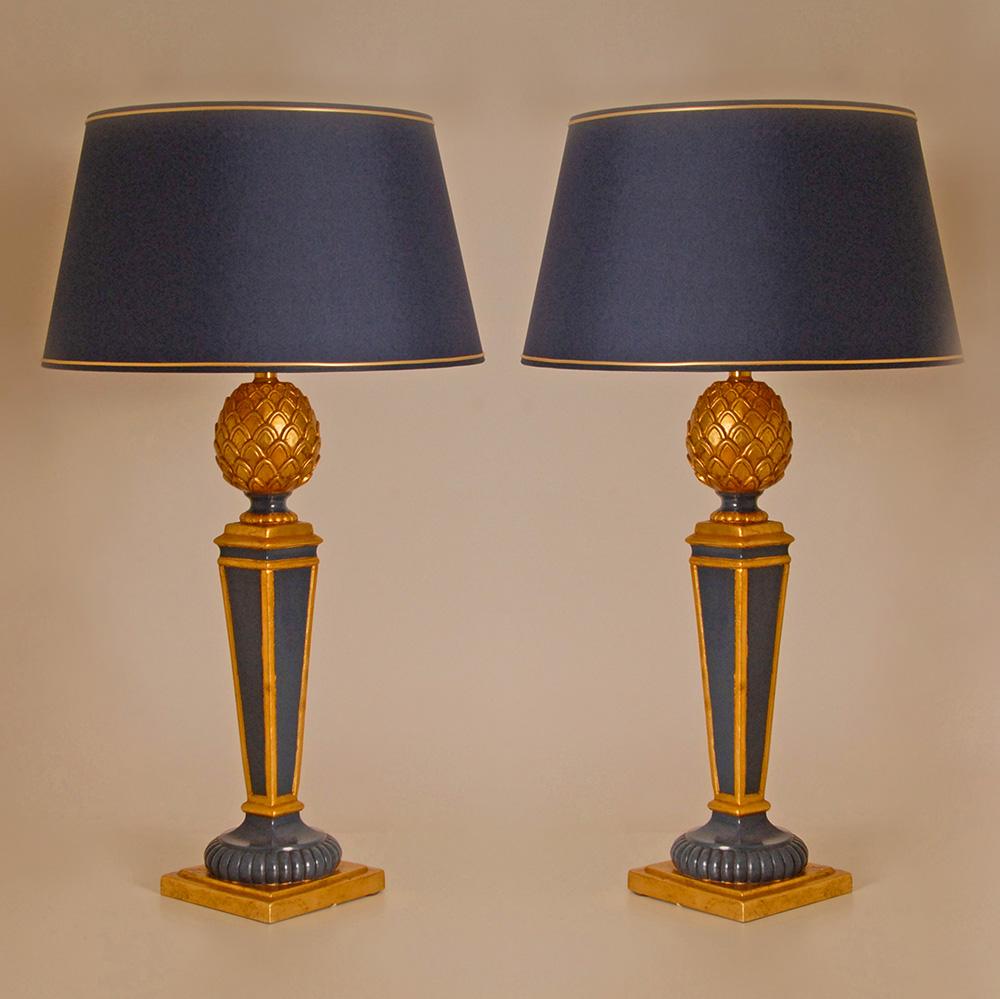 A paair vintage 1970s French lamps blue and faux gold giltwood pineapple table lamps.
Material: Giltwood, fruitwood, metal
Style: Vintage, Mid Century, Hollywood Regency, Traditional, Classic, Empire, Napoleonic
Design: In the style of Henredon,