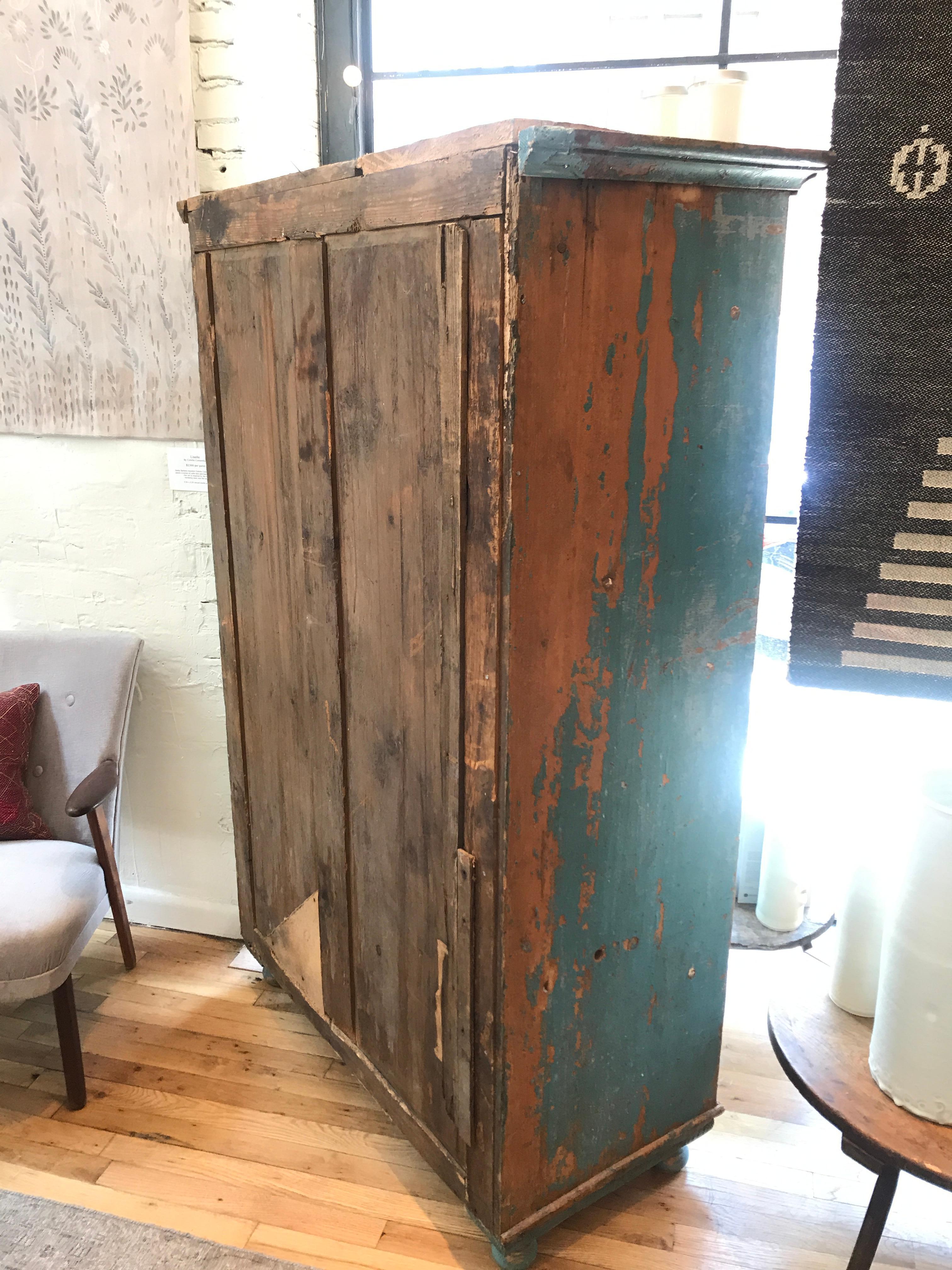 A charming colorful solution for your extra storage needs. With 5 drawers and, ample storage space for shelves. This vintage French wooden cabinet is a sensible show stopper in a lovely teal hue. A real conversation piece with elegant turned feet