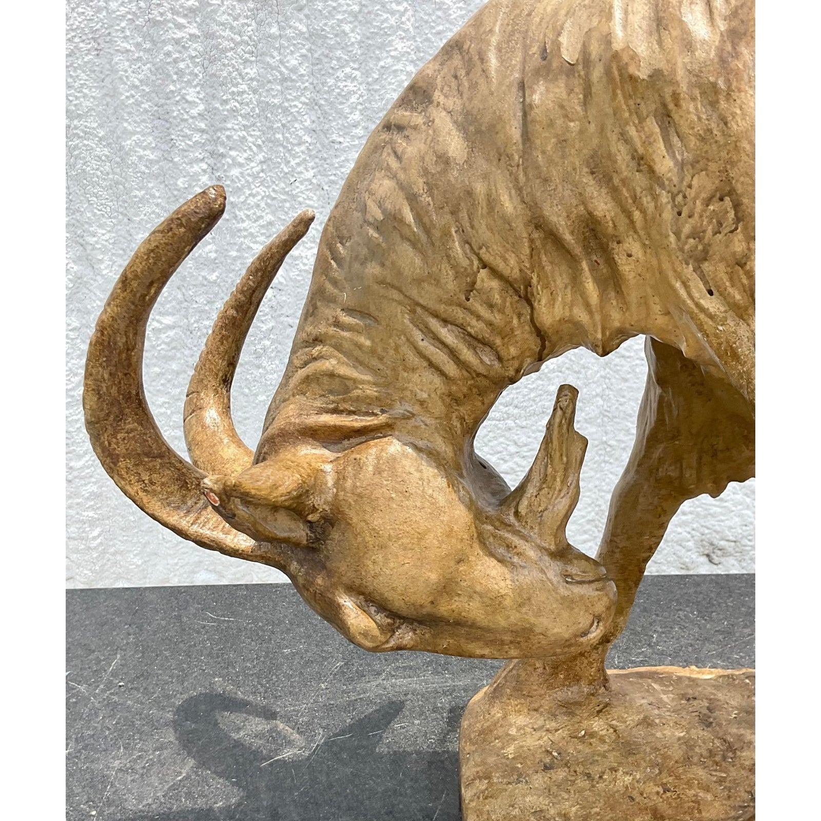 A fantastic and unique vintage terracotta goat sculpture that can add personality to any room. Acquired at a Palm Beach estate.