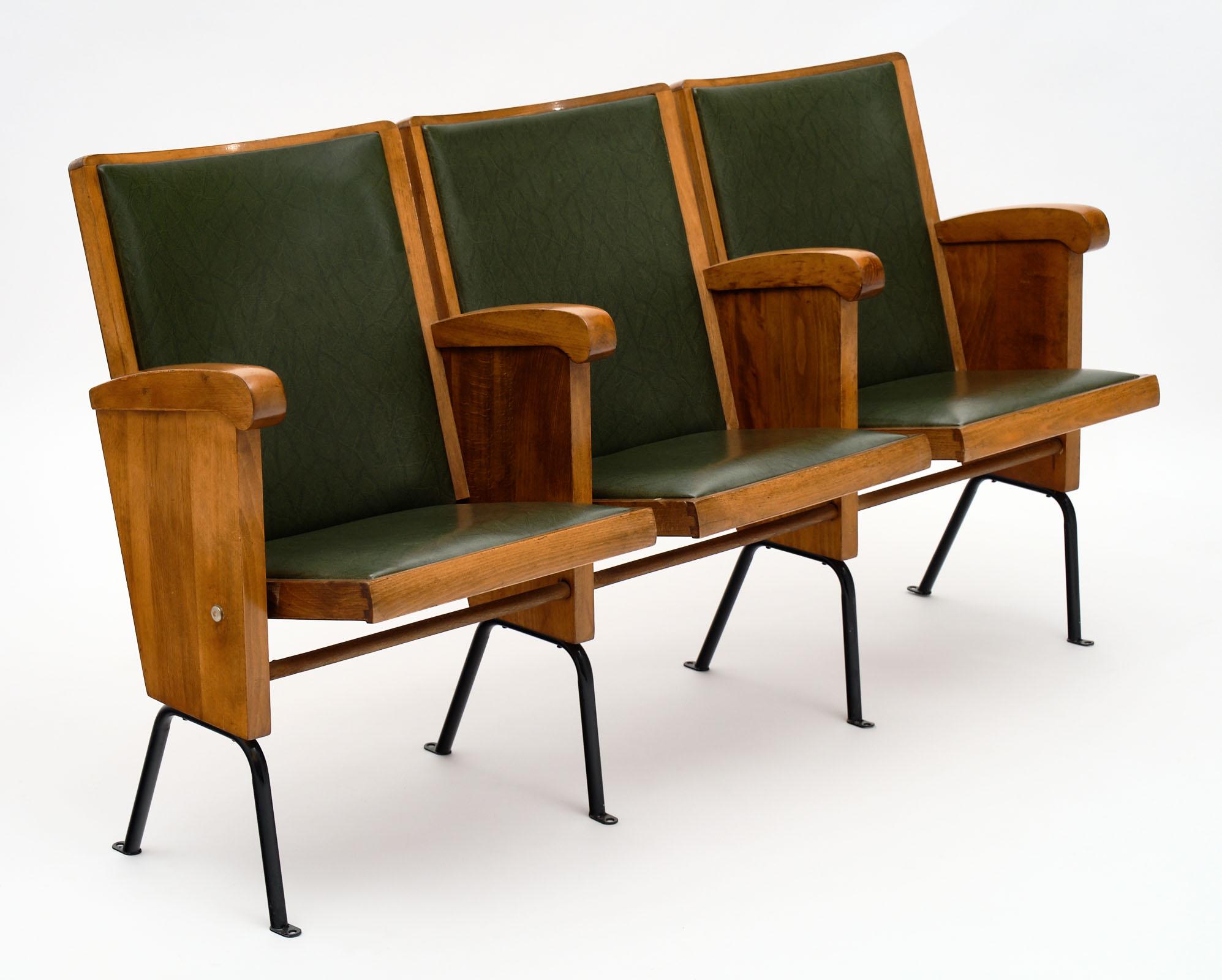 French vintage theater seats made of walnut and upholstered in the original green vinyl. The legs are metal. Each row has three seats - there are two rows and are priced per row. The depth listed is when the seats are up. When down, the depth of the