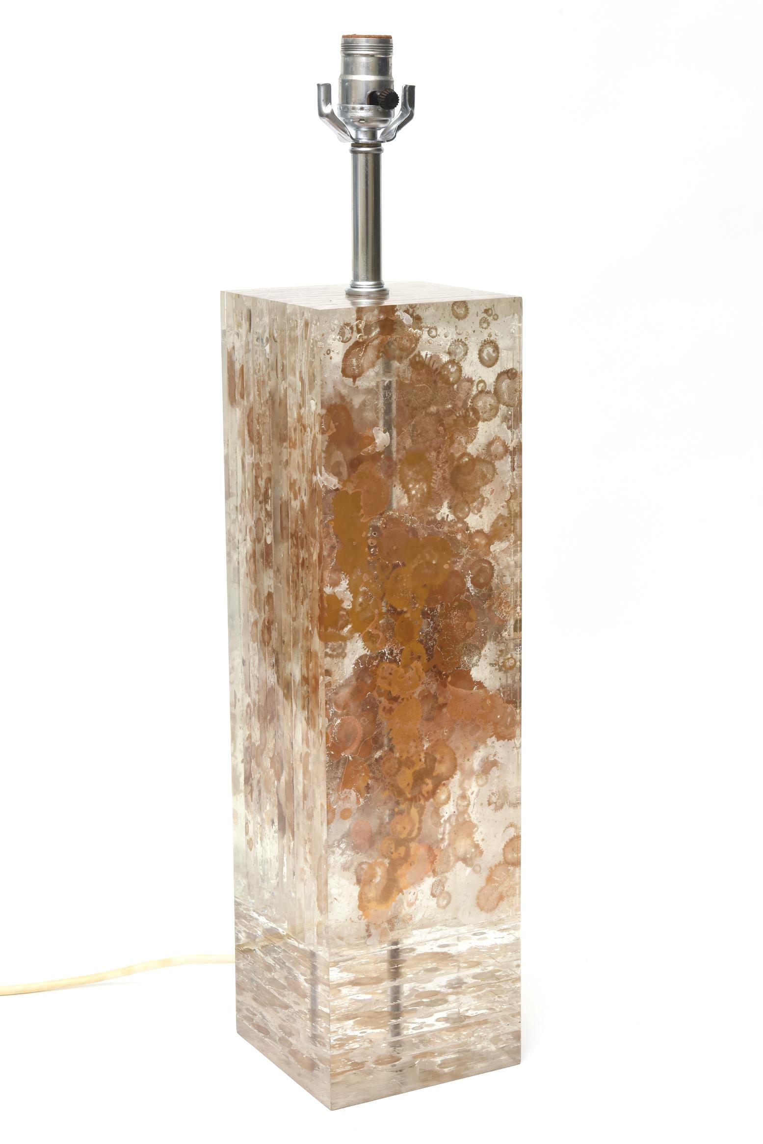 This amazing and stunning thick walled French vintage lucite column lamp is attributed to the work of Romeo Paris. It has inclusions of floating copper and gold leaf elements in fractal form. It is tall, heavy and has separate lucite columns inside.