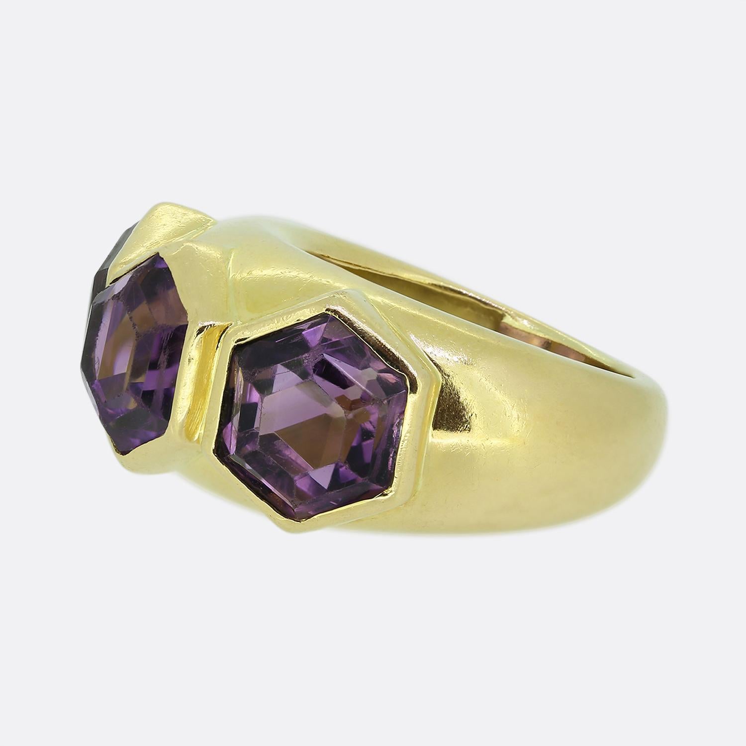 Here we have an outstanding three-stone cocktail ring. This grand vintage piece was crafted in France from a rich 18ct yellow gold and boasts three fabulous hexagonally shaped amethysts. Each natural stones sits risen in a bezel setting in a convex