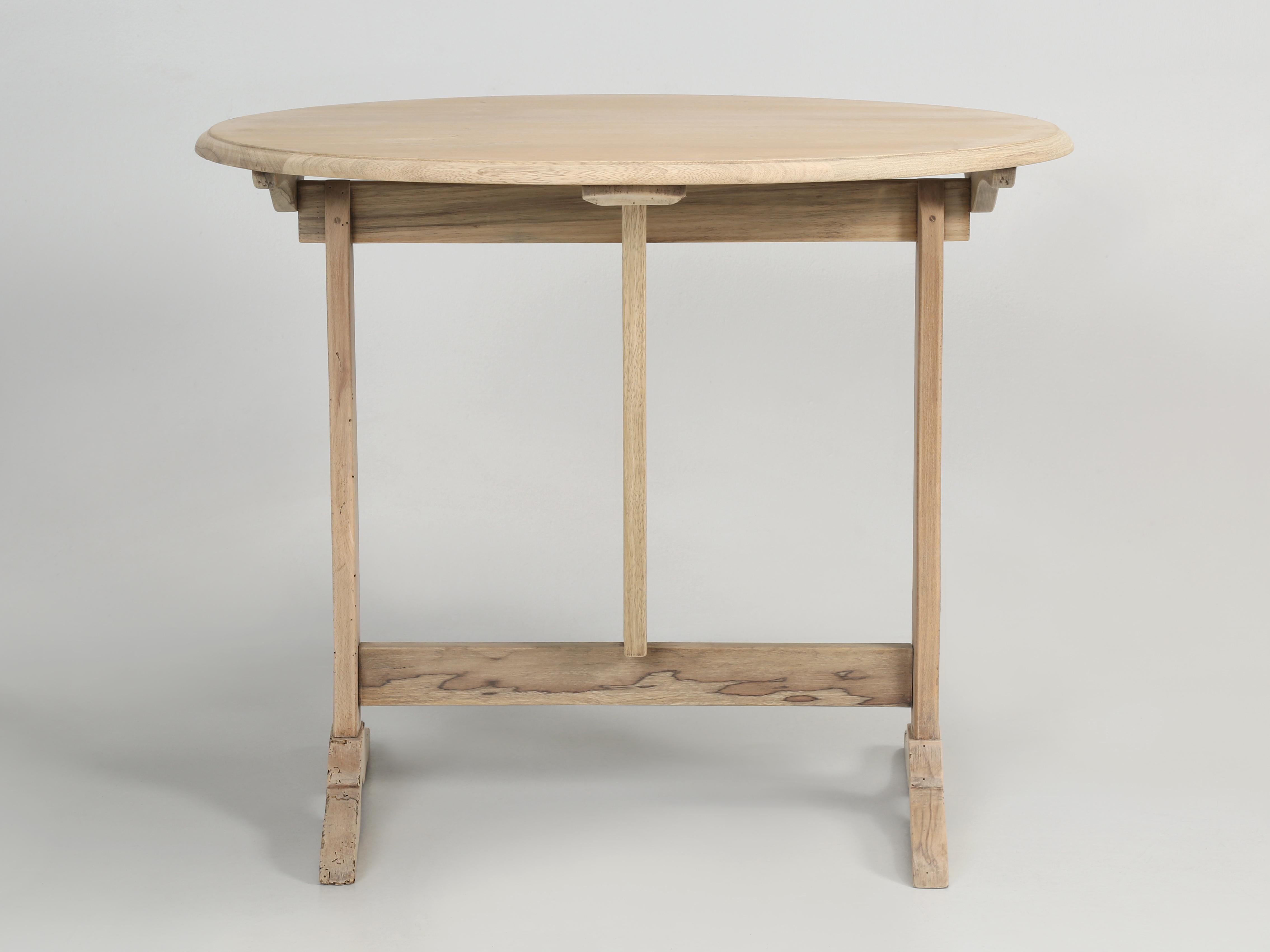 French Vintage Wine Tasting Table of unusual proportions and scale. Our Wine Tasting Tilt-Top Table could double as an End Table or Side Table. The finish of the white oak Wine Tasting Table can best be described as stripped and could be left as is,