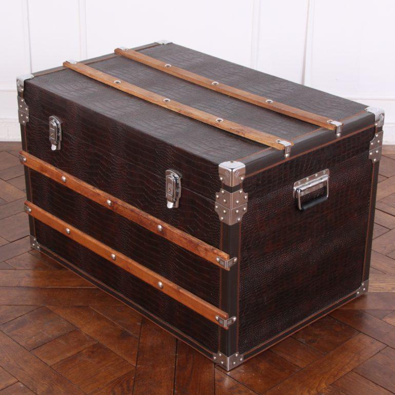 A vintage French faux alligator-skin trunk with wooden and metal fittings.




    