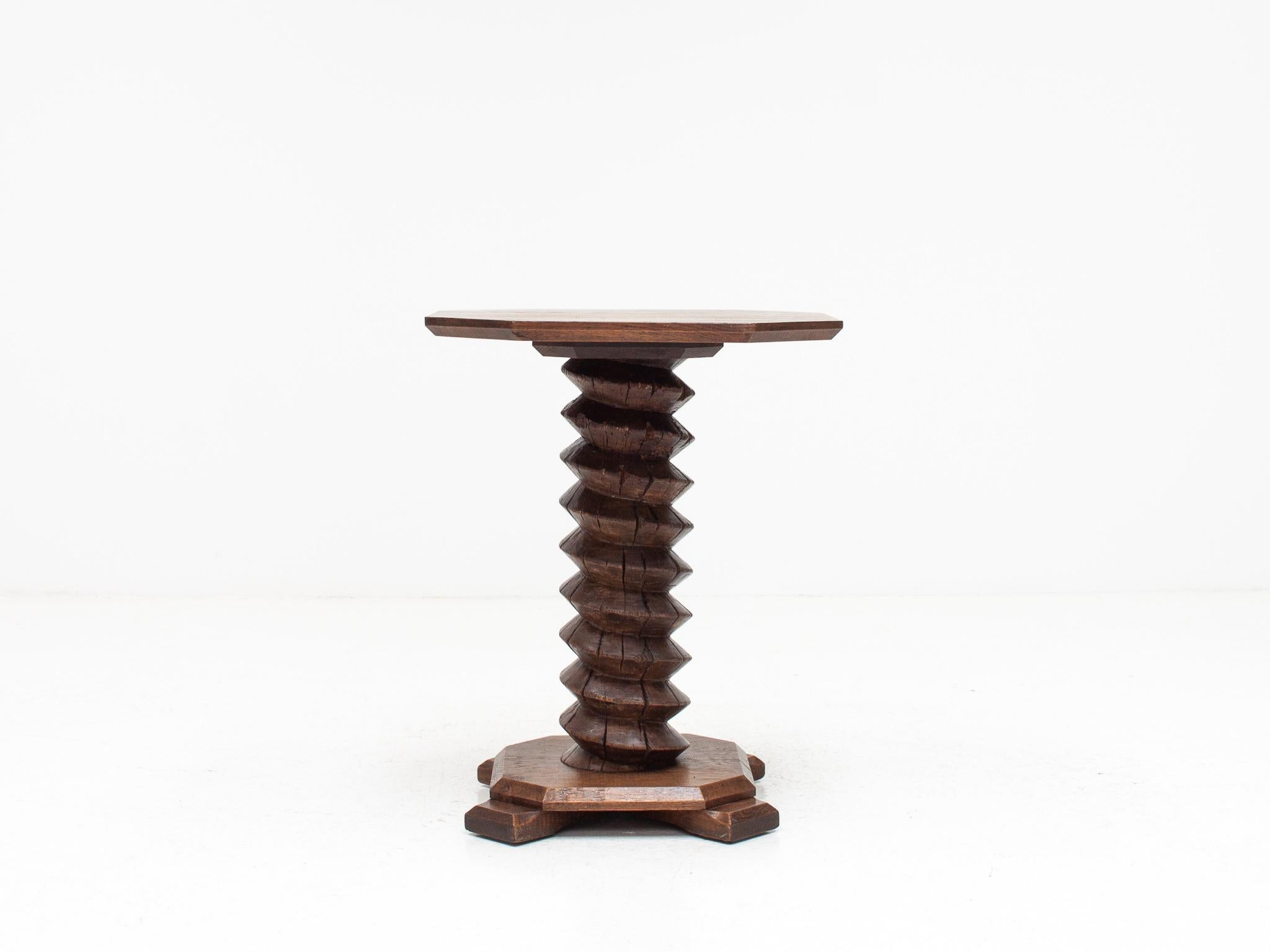 A French pedestal table with a turned column stem, reminiscent of Charles Dudouyt designs.

Table form most probably dates from the early-Mid 20th Century with the turned screw column from an earlier date and most probably used as part of a wine