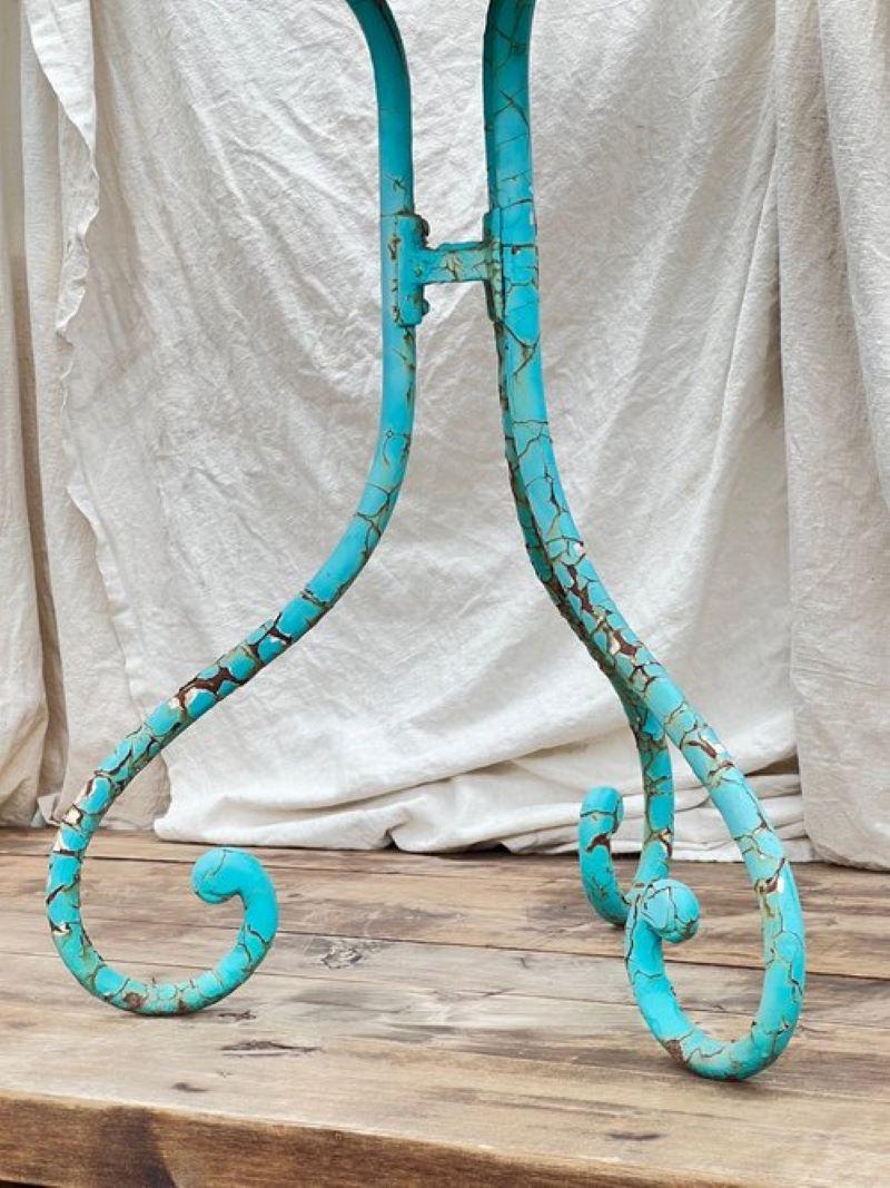 Antique french turquoise bistro table, featuring an elegant fashioned base. Timeless charm for your space.  beautiful patina.

Measurements: 28” H x 26” W

Condition: Consistent with vintage age and usage.