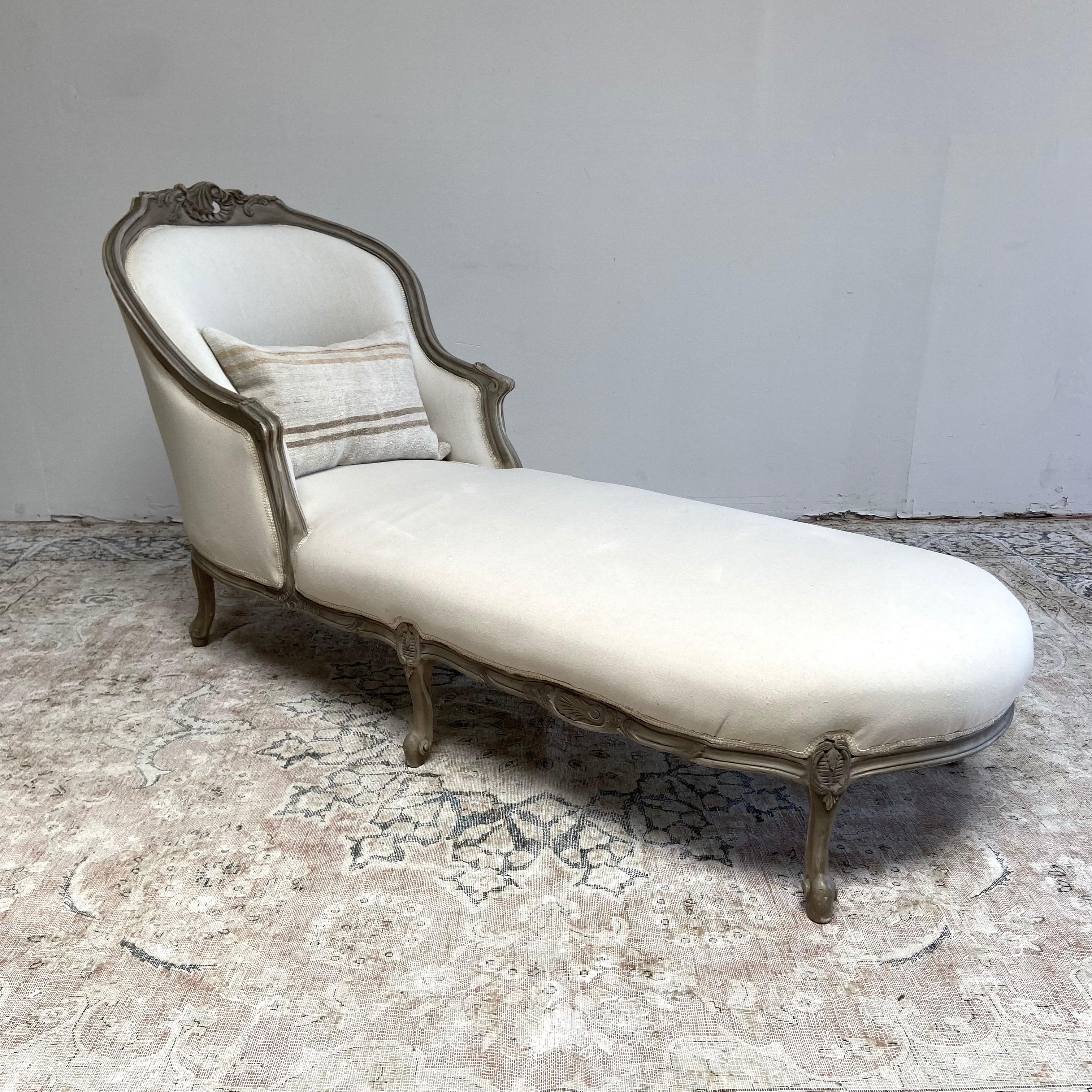 Chaise lounge 38”W x 80”D x 41”H
Seat H:18”. Seat D:71”. Arm H:26”
Painted and upholstered vintage chaise lounge in gustavian gray finish with subtle distressed edges, and antique patina.
Upholstered in a cotton muslin, with french braided