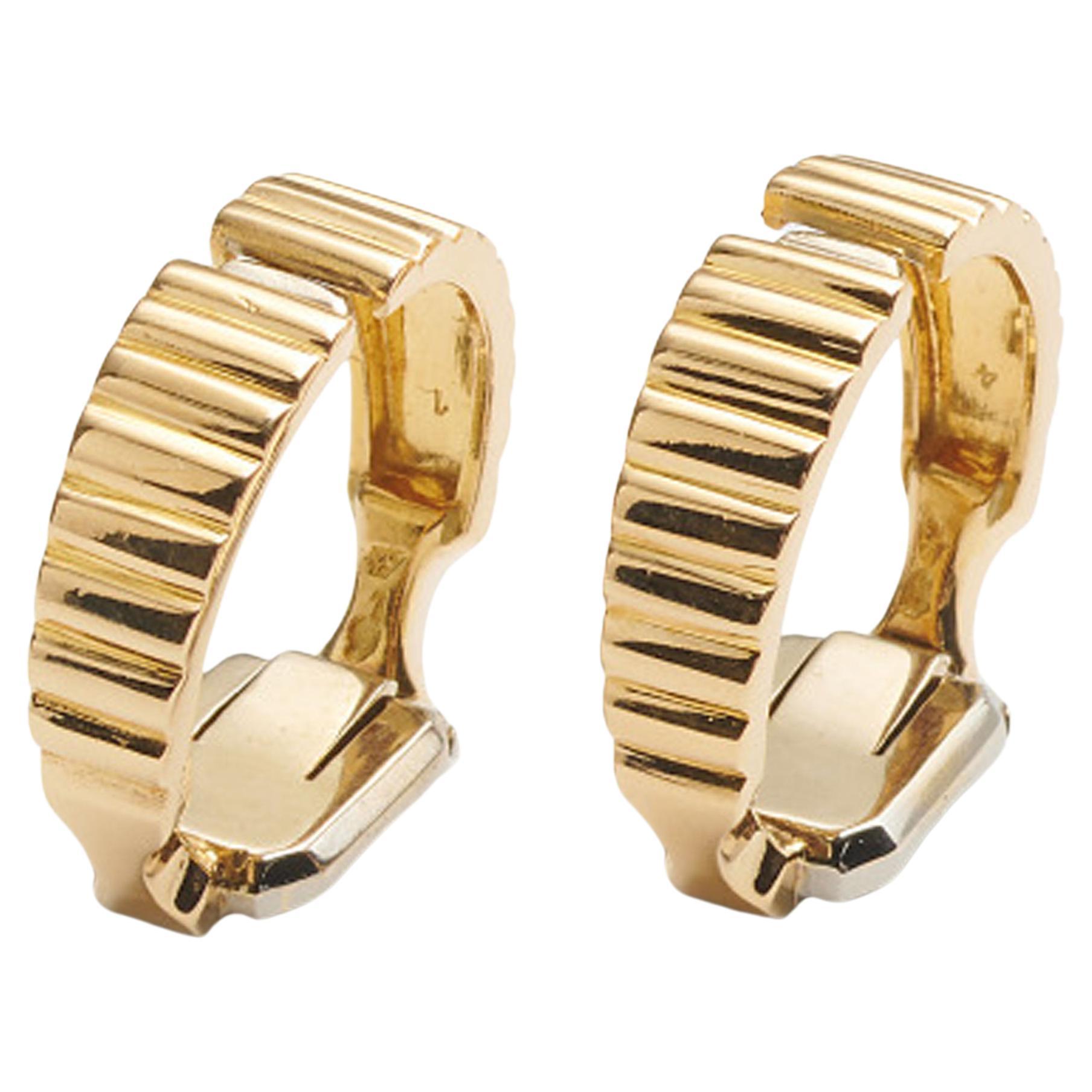 Van Cleef
Arpels Boutons de manchette étriers français vintage en or 18 carats, vers 1960