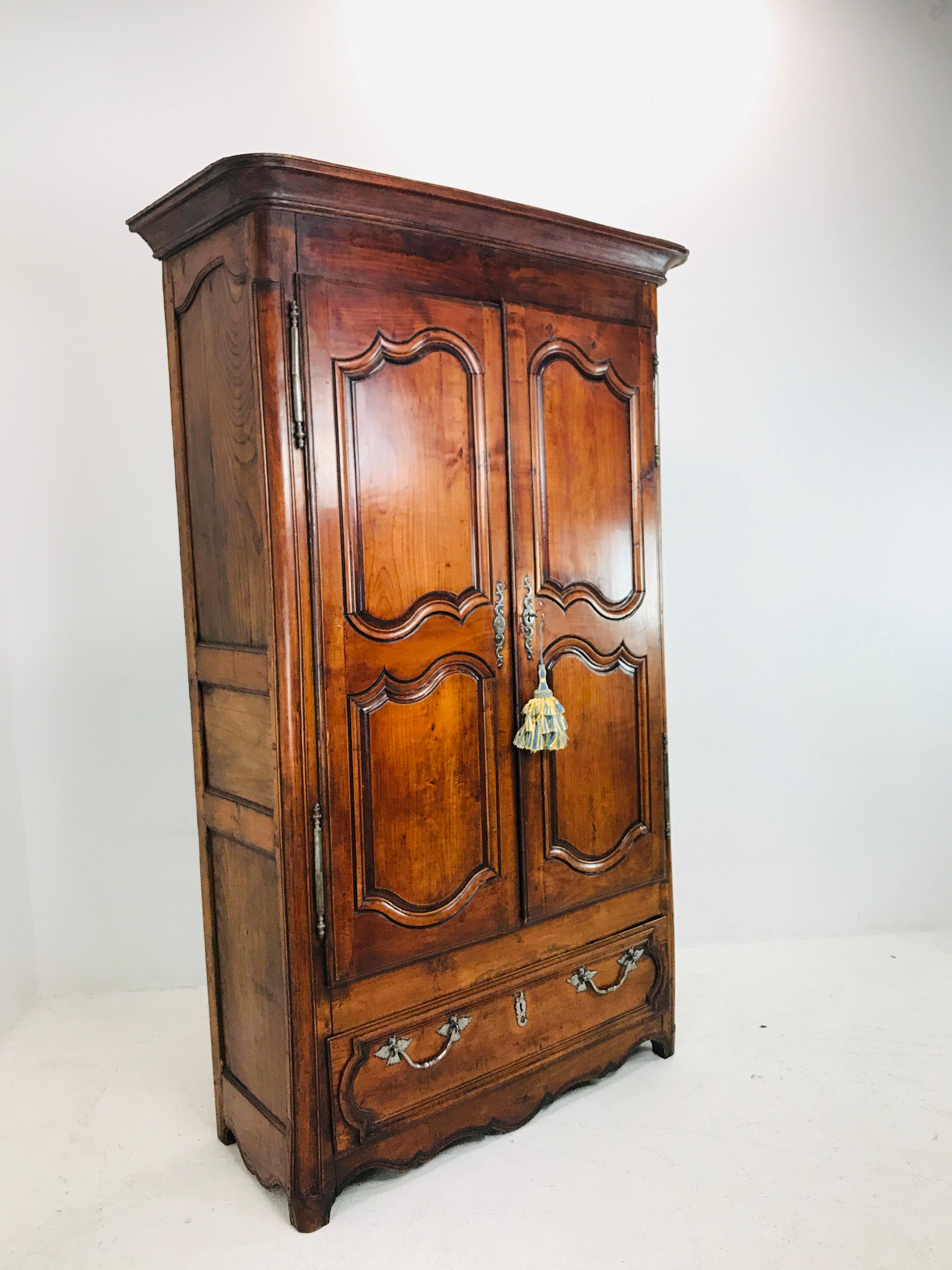 Classic vintage 1930s French 2-door walnut armoire with 3 shelves and bottom drawer. Armoire measures: 37.5