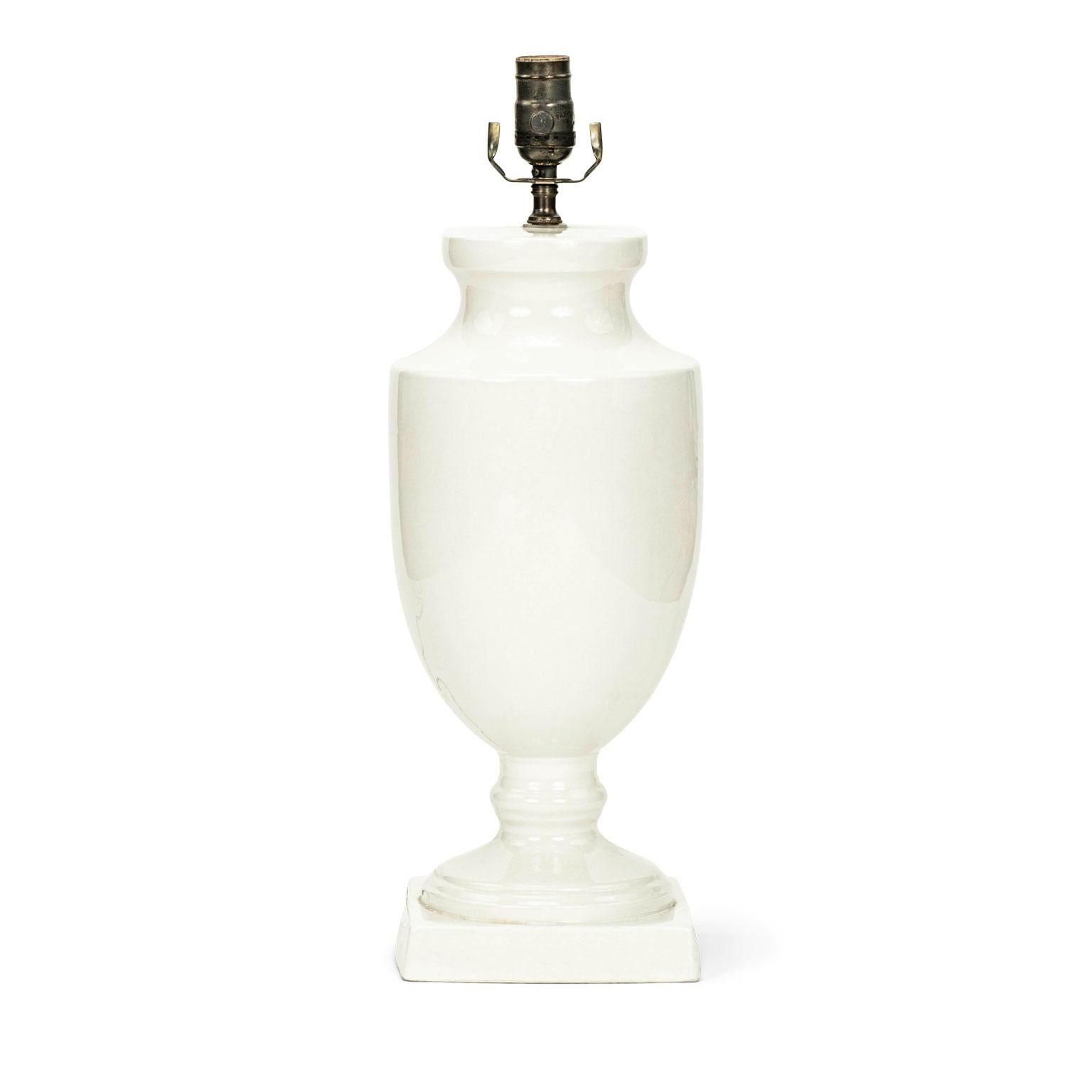 Vintage French white ceramic table lamp. Urn-shape lamp newly wired for use within the USA. Sold without shade (listed height measures from base to top of socket).