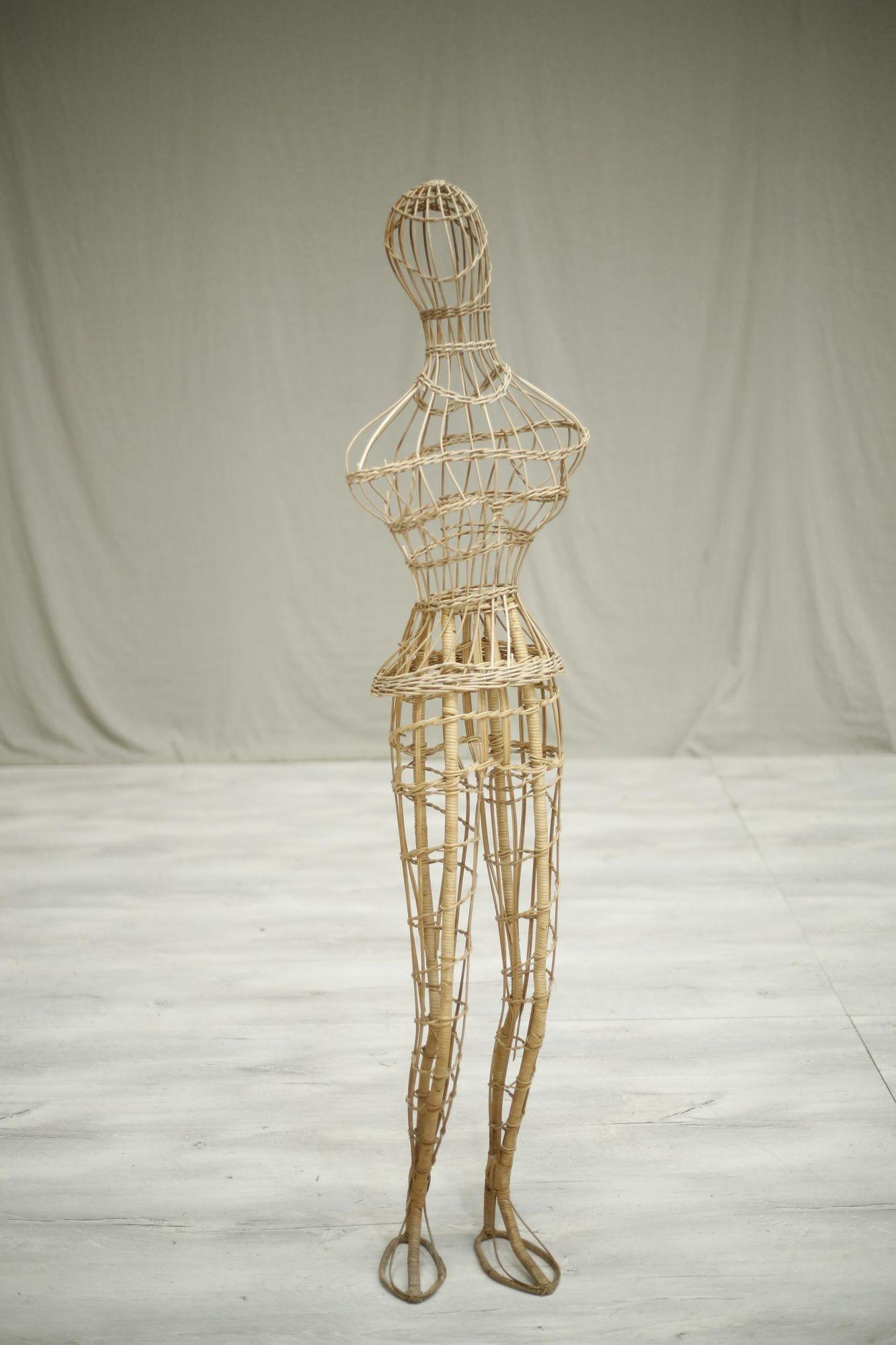 This is a very quirky piece from a Dress makers shop in France. A 1950's mannequin of a female that makes a great curio piece for any interiors. Quirky but beautifully sculptural. The wicker frame is in overall very good condition for its age with