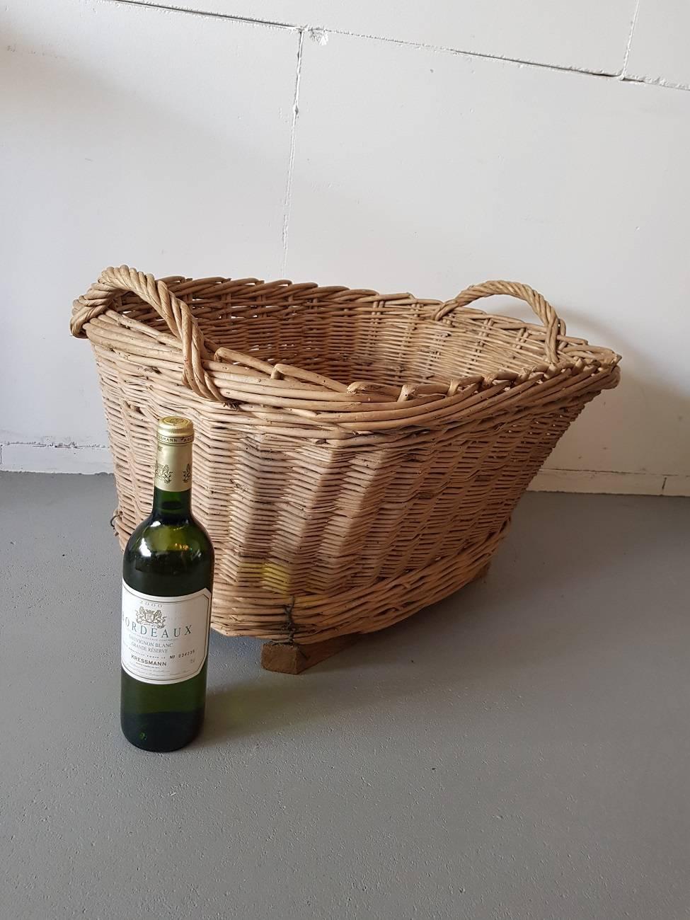 Vintage French grape basket made in the 1970s-1980s and used in the Champagne region of Reims and it's further in a good and stable condition.

The measurements are,
Depth 52 cm/ 20.4 inch.
Width 66 cm/ 25.9 inch.
Height 35 cm/ 13.7 inch.
 