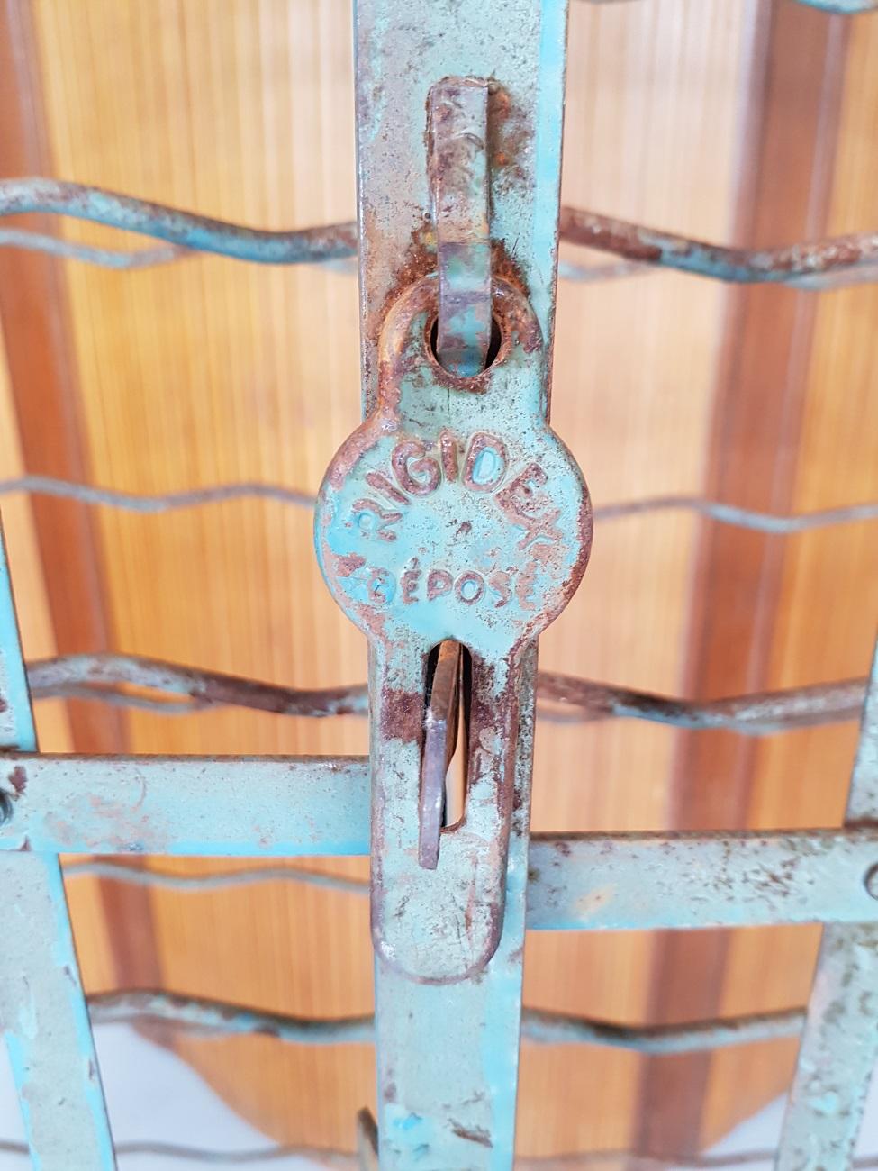 Vintage French wine rack labeled Rigidex Déposé and can 150 bottles, and can be put through an unlocked padlock, mid-20th century.

The measurements are,
Depth 37 cm/ 14.5 inch.
Width 100 cm/ 39.3 inch.
Height 166 cm/ 65.3 inch.
 