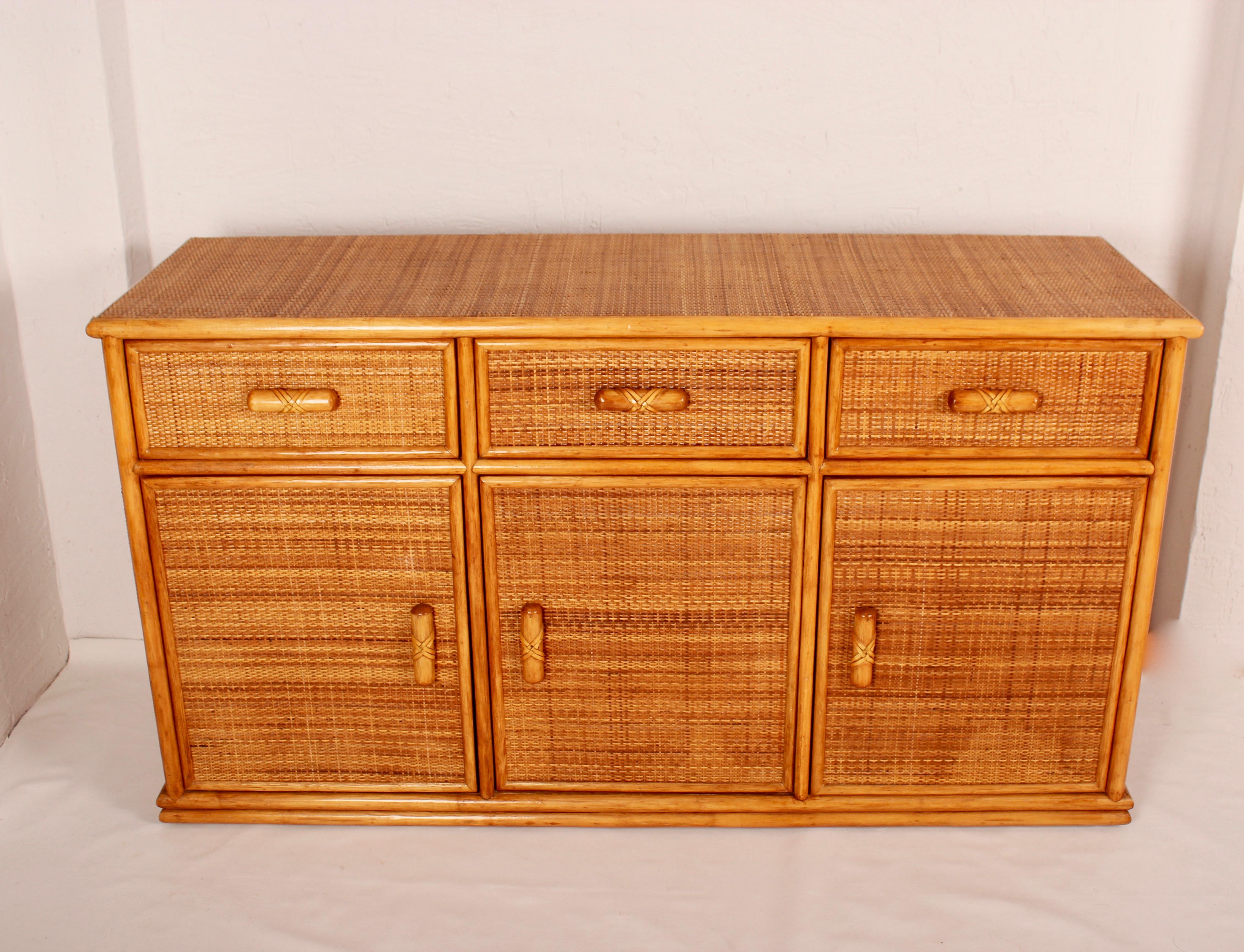 Typical south of France 1970s buffet in wood fully covered with rattan, perfect condition, three-door and three drawers.