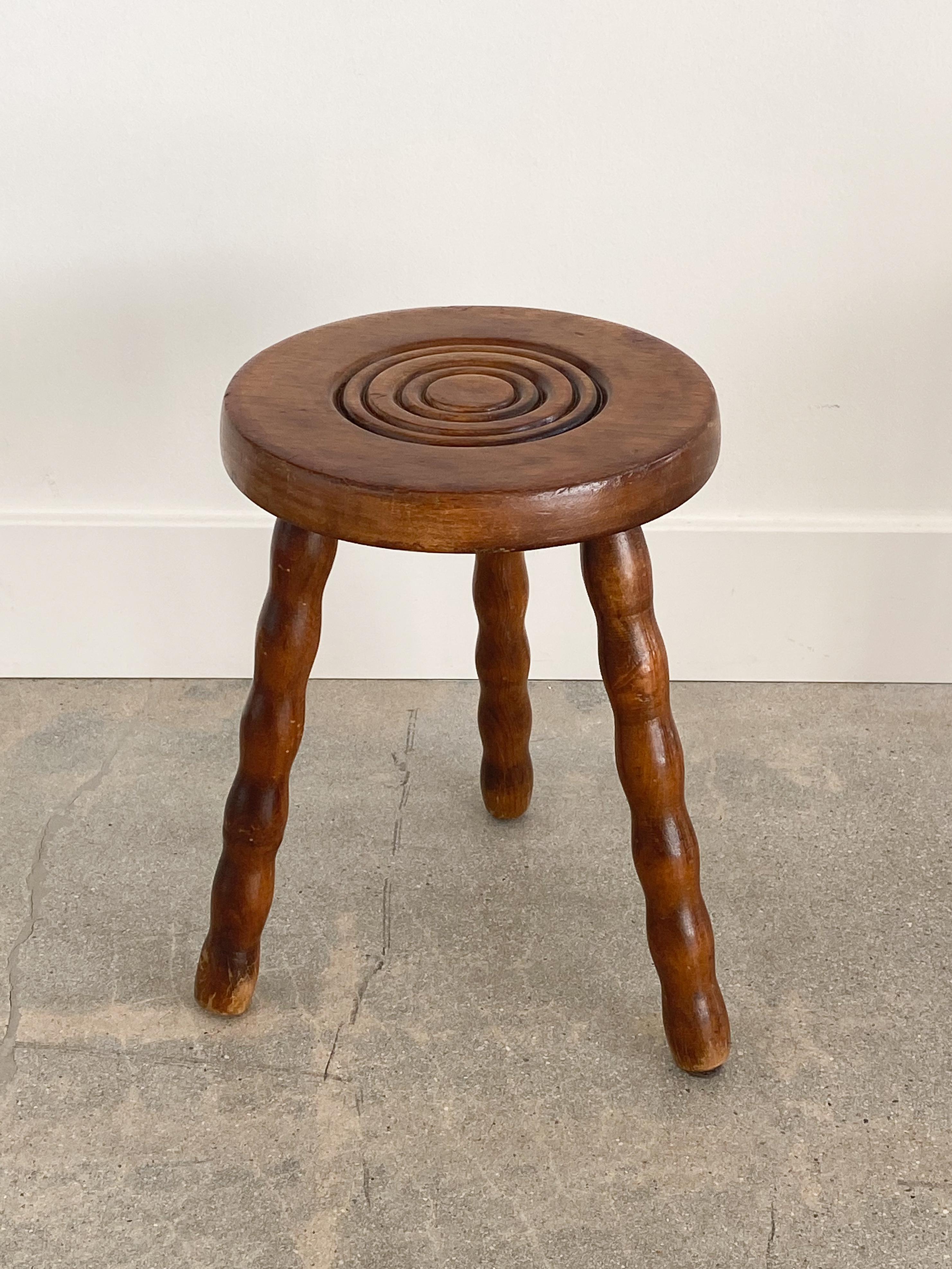 Vintage wood stools with beautiful wavy wood legs from France. Circular seats each with unique carved ring detail. Original wood finish with great age markings and patina. Can be used as small stools or as side tables next to chairs. Price is for a