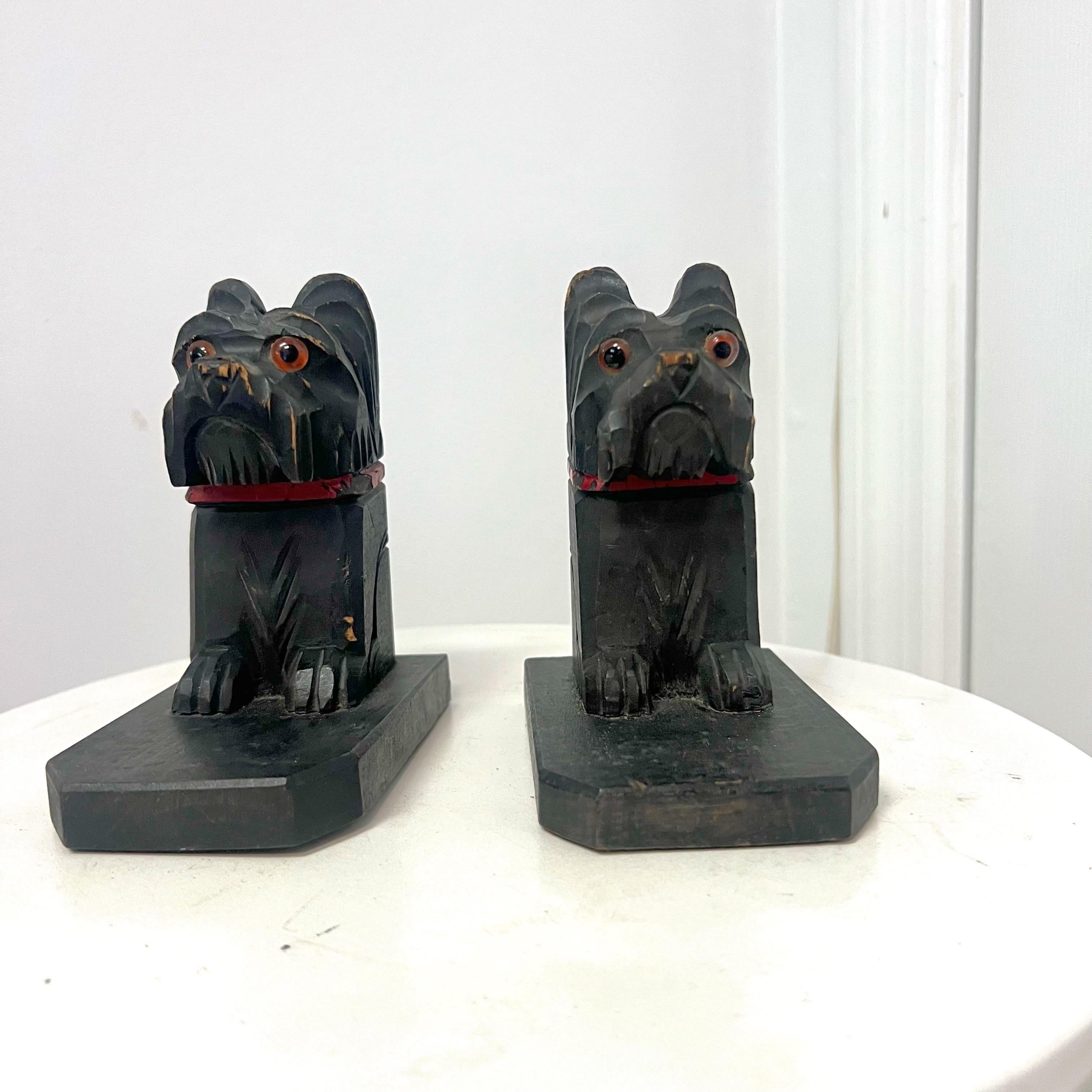 **Vintage Carved Wooden Dog Bookends - Pair**

Add a touch of vintage charm to your home or office with this unique pair of carved wooden dog bookends. Expertly crafted, these bookends feature two adorable dogs, each meticulously carved with fine