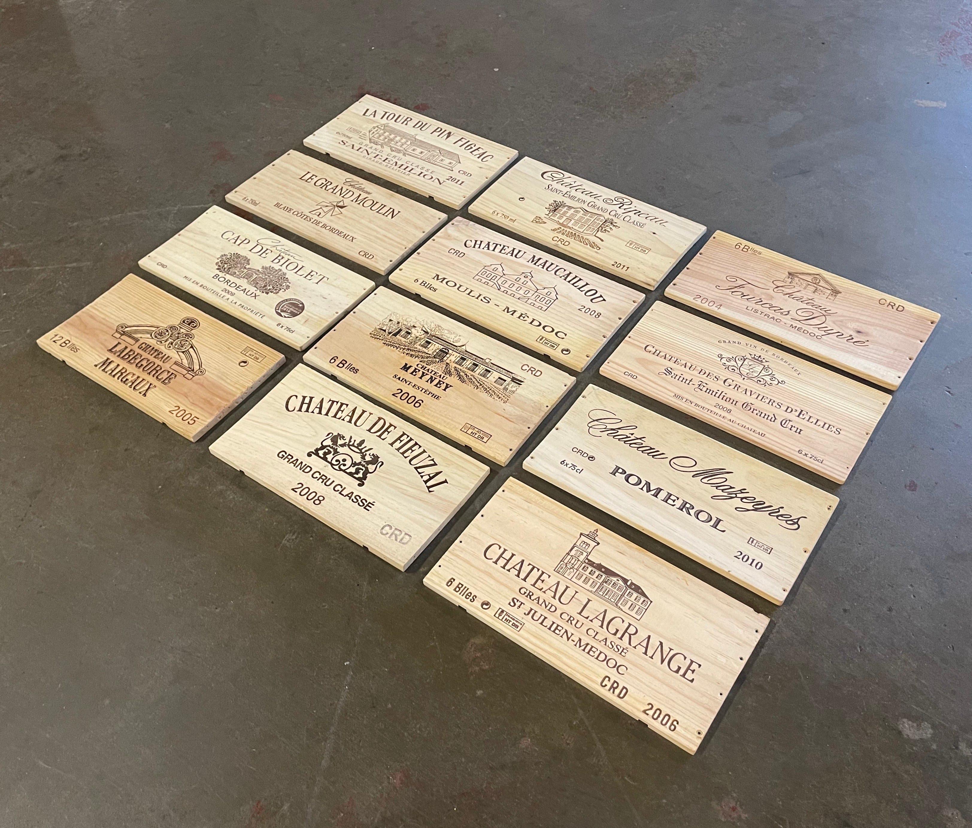 Decorate a wine cellar wall with this set of French wine labels. Crafted in France circa 2000, each wooden label features a well known French Bordeaux Chateau. The set includes 