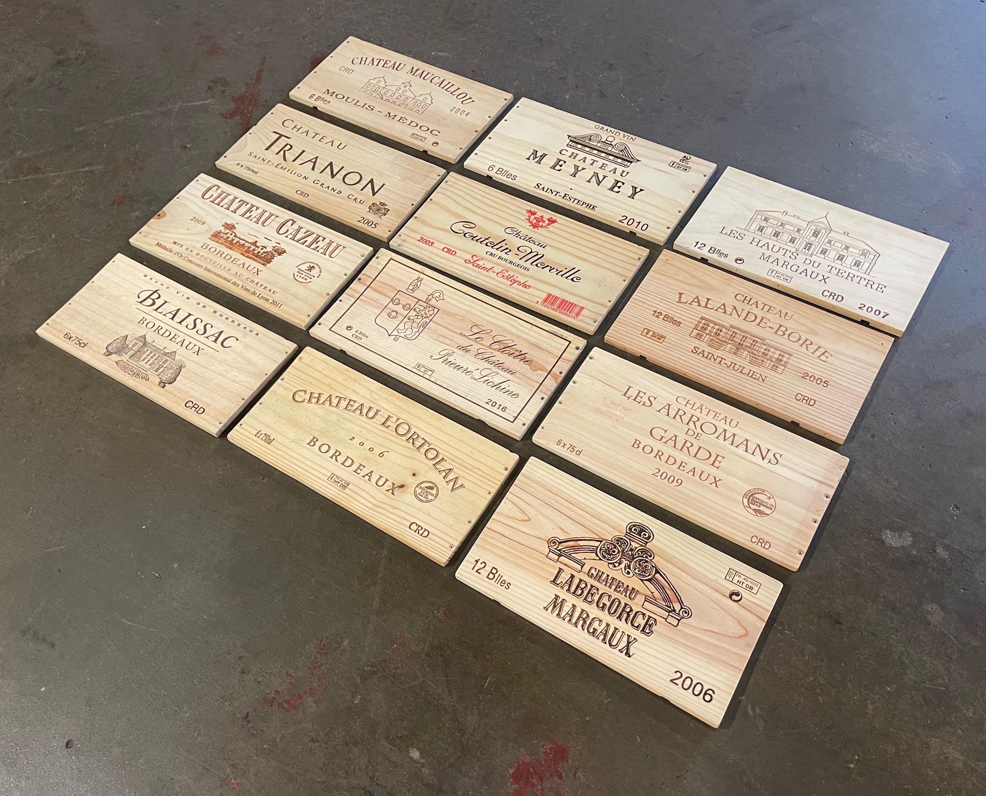 Decorate a wine cellar wall with this set of French wine labels. Crafted in France circa 2000, each wooden label features a well known French Bordeaux Chateau. The set includes 