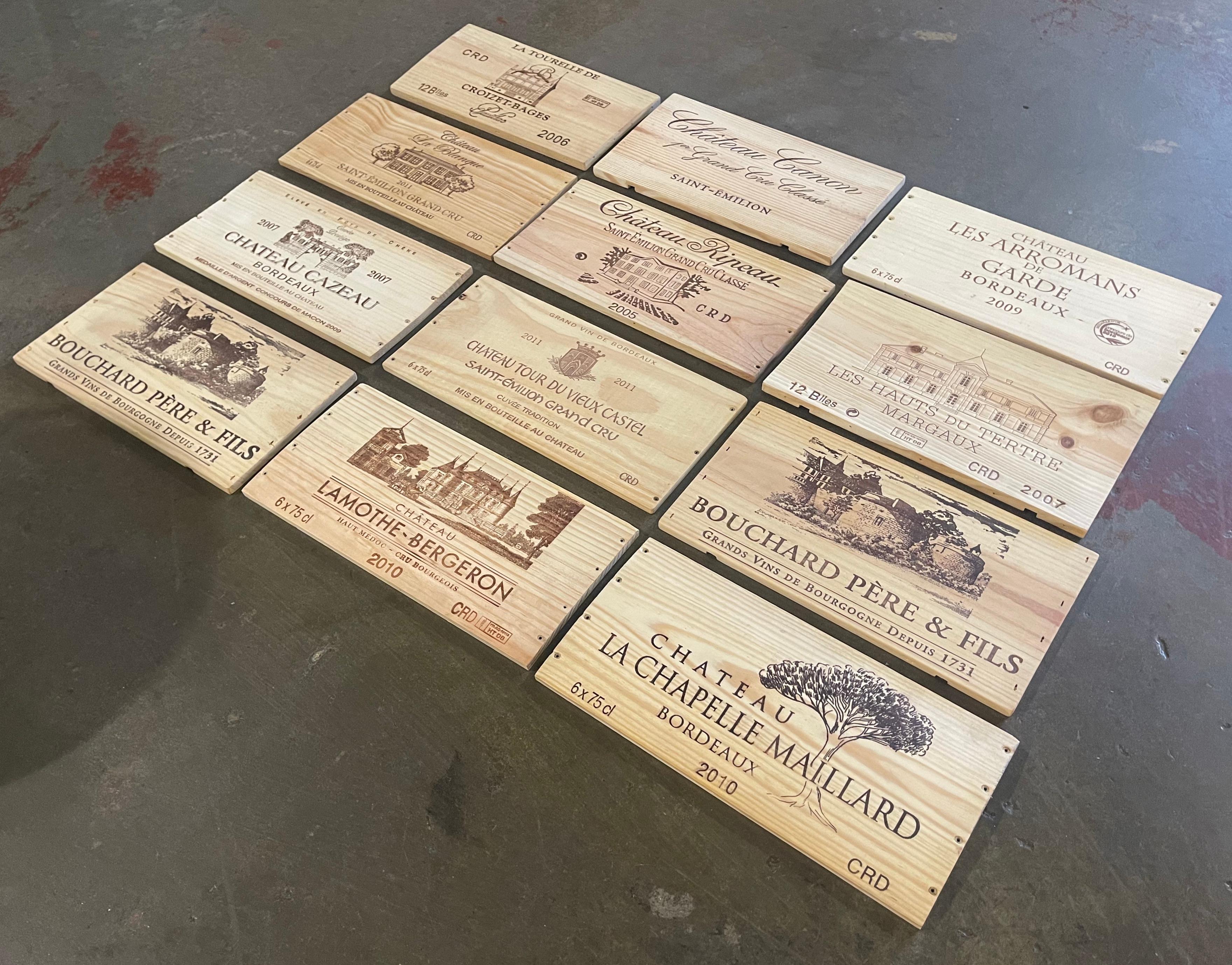 Decorate a wine cellar wall with this set of French wine labels. Crafted in France circa 2000, each wooden label features a well known French Bordeaux Chateau. The set includes (two) 