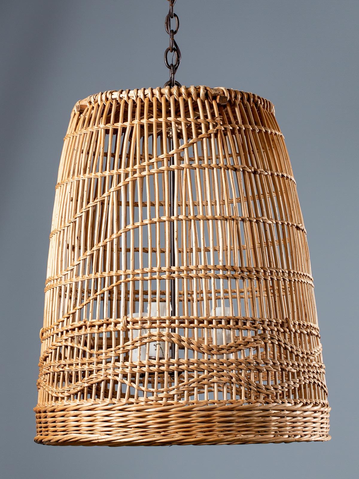 A super vintage French handwoven reed basket chandelier light fixture lantern circa 1920. Please enlarge the photographs to see the terrific pattern of the wave like weave in this bell shaped light fixture. We have now converted the basket into a