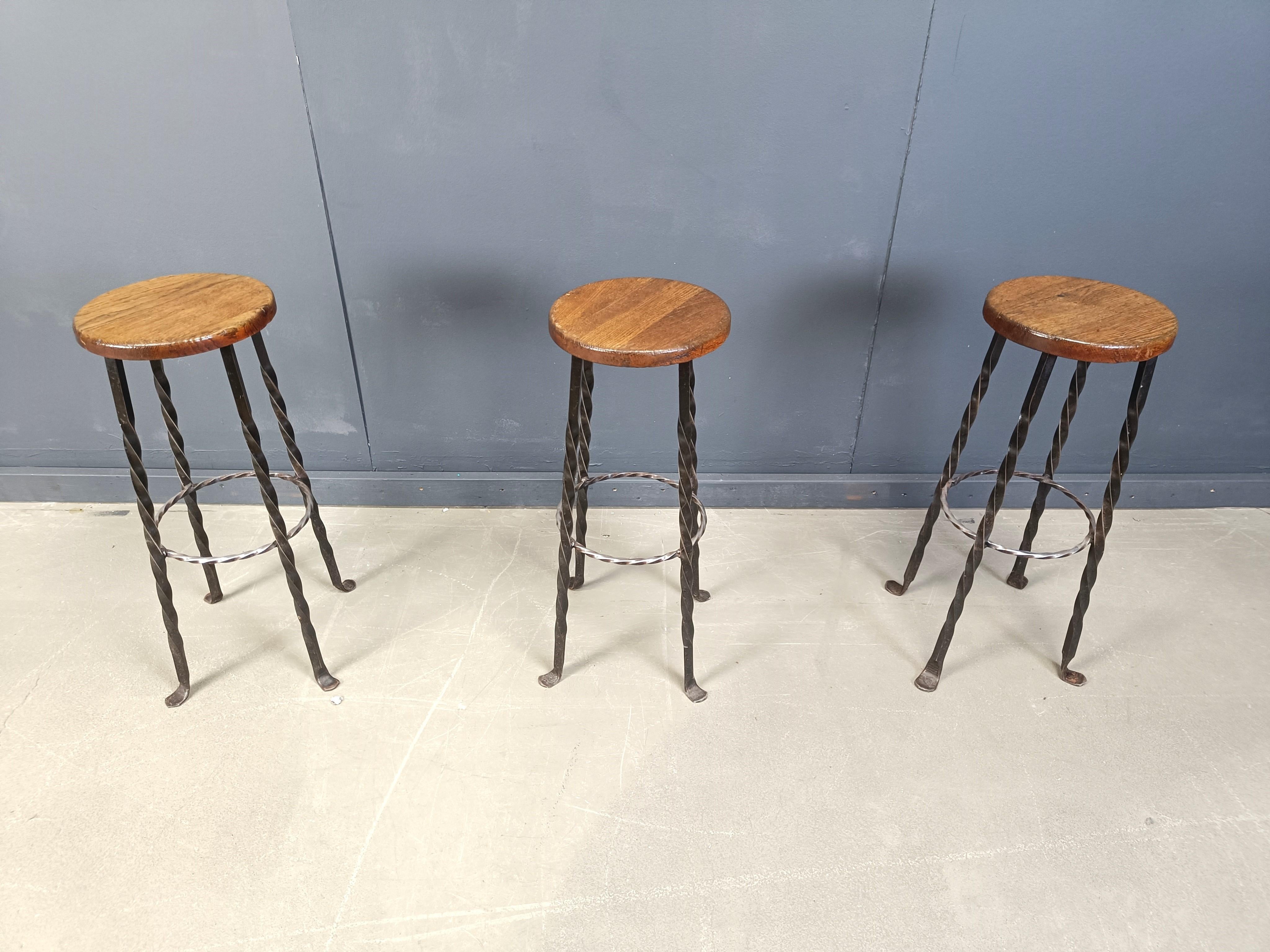 Vintage bar stools made from a round oak seat and a beautiful wrought iron twisted base with elegant feet.

1960s  - France

Very good, sturdy condition

Dimensions:
Height: 78cm
Diameter: 40cm

Ref.: 2506100202

*Price is for the set
*Images are a