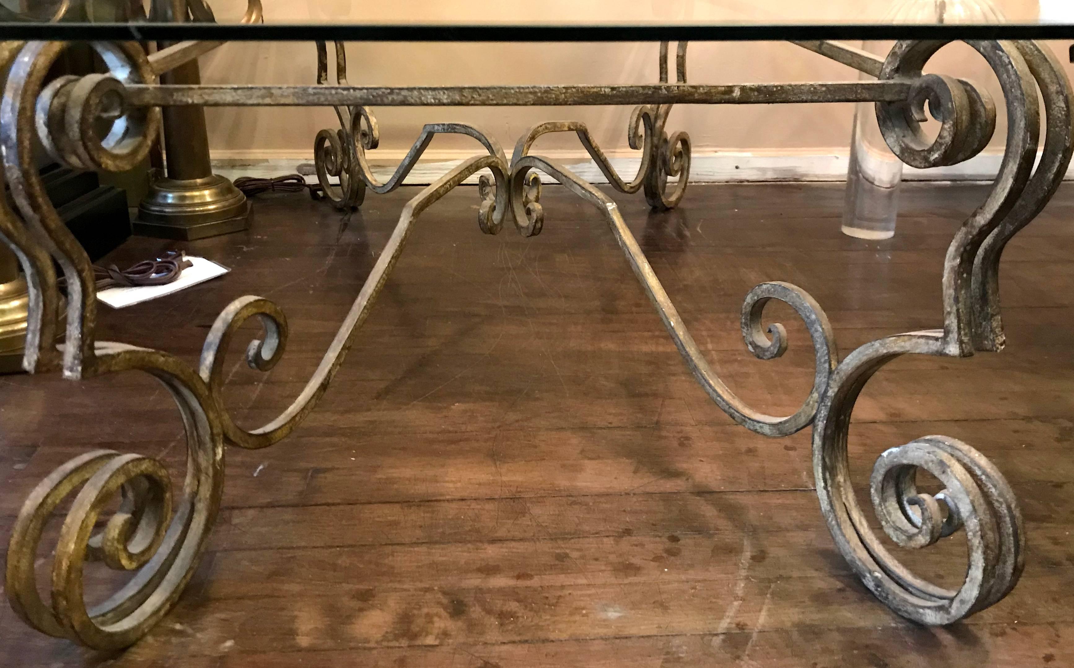 A circa 1930s, French wrought iron coffee table with glass top. Original distressed painted finish. 

Measurements:
Height: 16