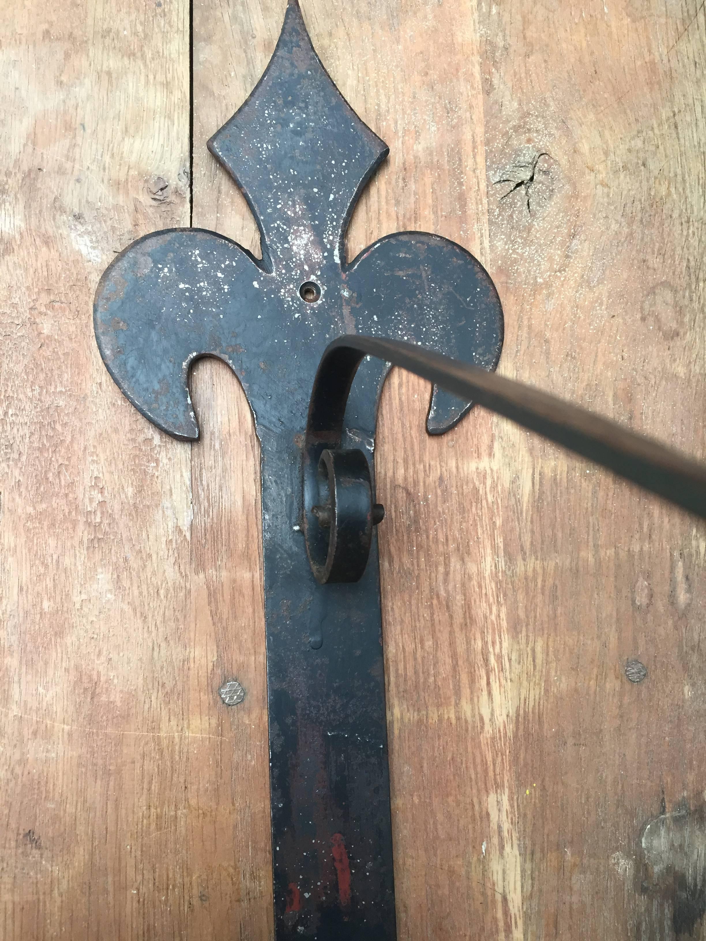 Lovely French wall bracket made to hold a shop sign but could also be used to hang a large plant basket.
Hand wrought iron circa 1930.