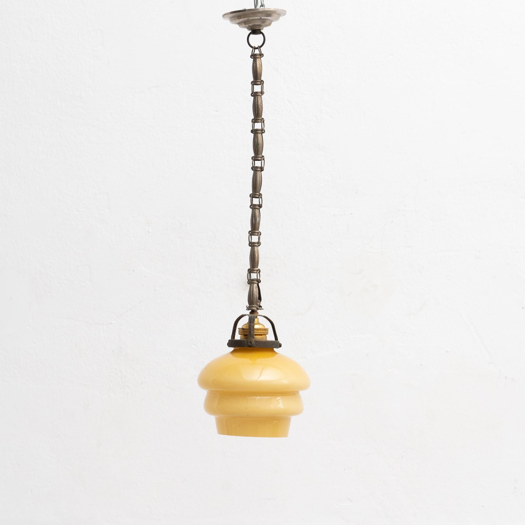 French vintage yellow glass ceiling lamp.

By unknown manufacturer from France, circa 1930.

In original condition, with minor wear consistent with age and use, preserving a beautiful patina.

Materials:
Glass
Metal.
    