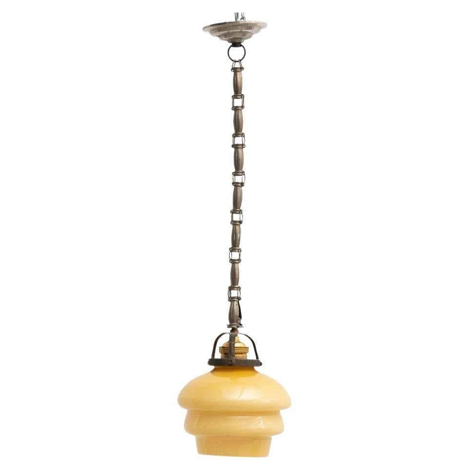 French vintage yellow glass ceiling lamp.

By unknown manufacturer from France, circa 1930.

In original condition, with minor wear consistent with age and use, preserving a beautiful patina.

Materials:
Glass
Metal.
 
Electrification for